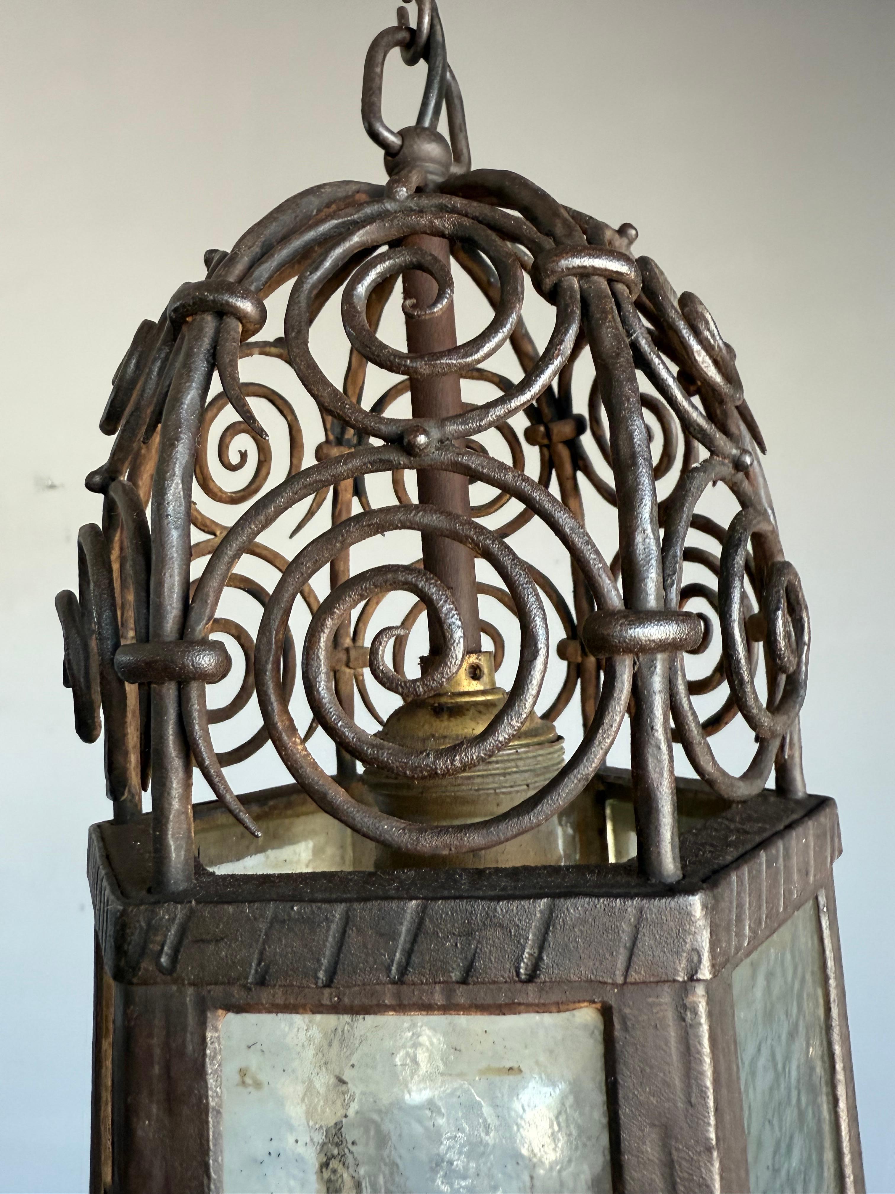 Glass Arts and Crafts, Moorish Inspired Wrought Iron Lantern with Ornate Openwork Top For Sale