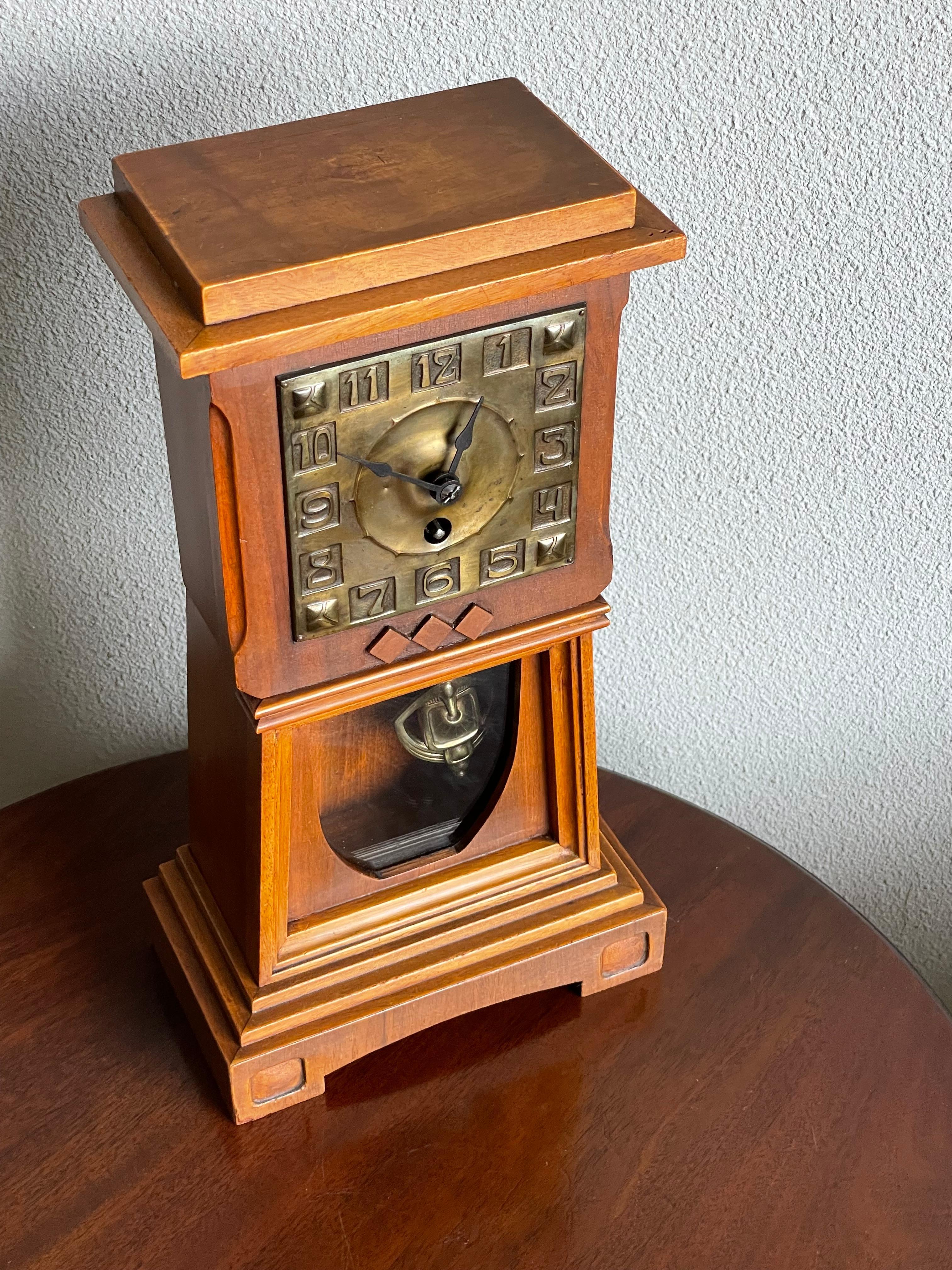 European Arts and Crafts Nutwood Mantel or Table Clock with an Embossed Brass Dial Face For Sale