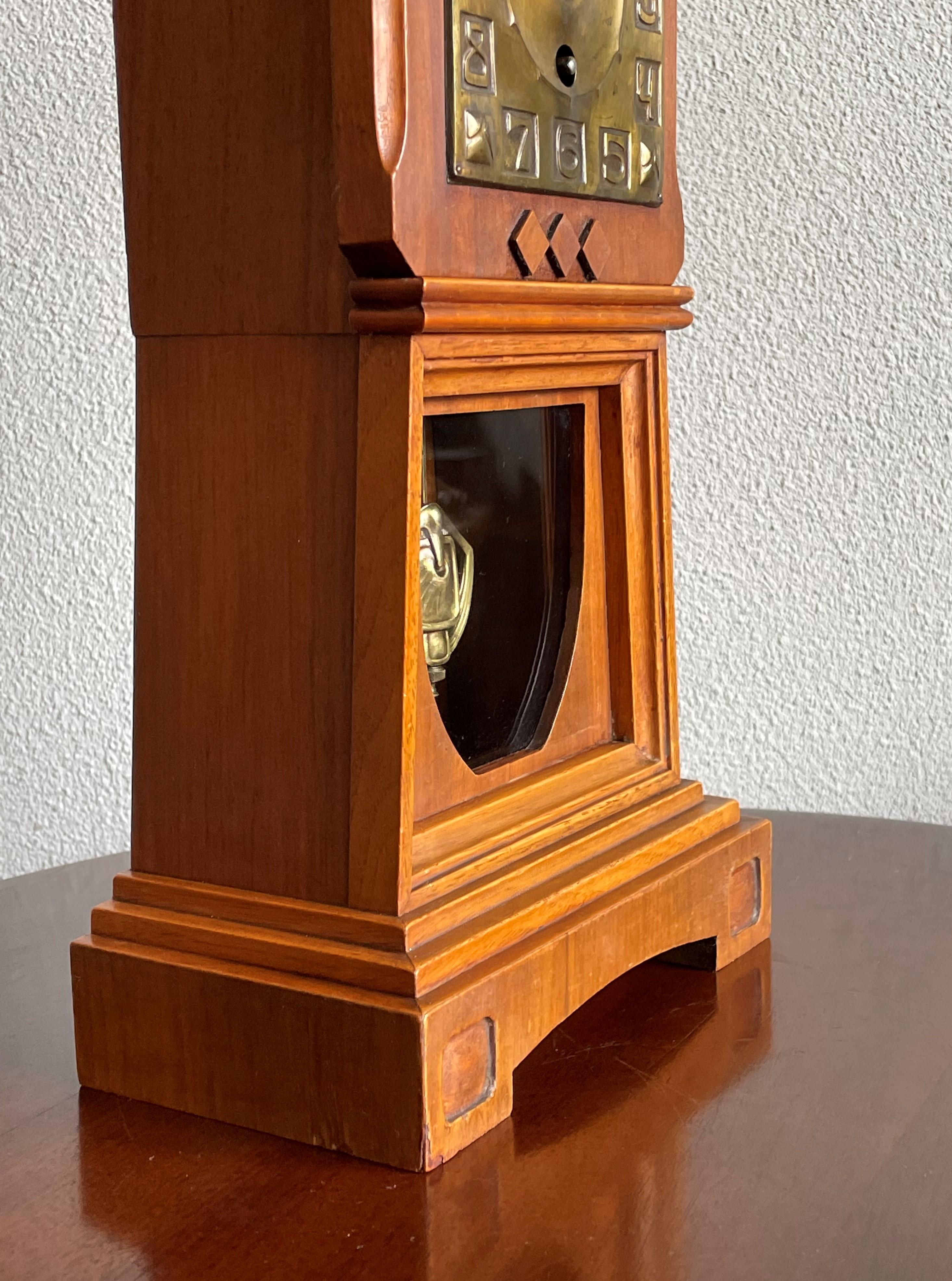 Blackened Arts and Crafts Nutwood Mantel or Table Clock with an Embossed Brass Dial Face For Sale