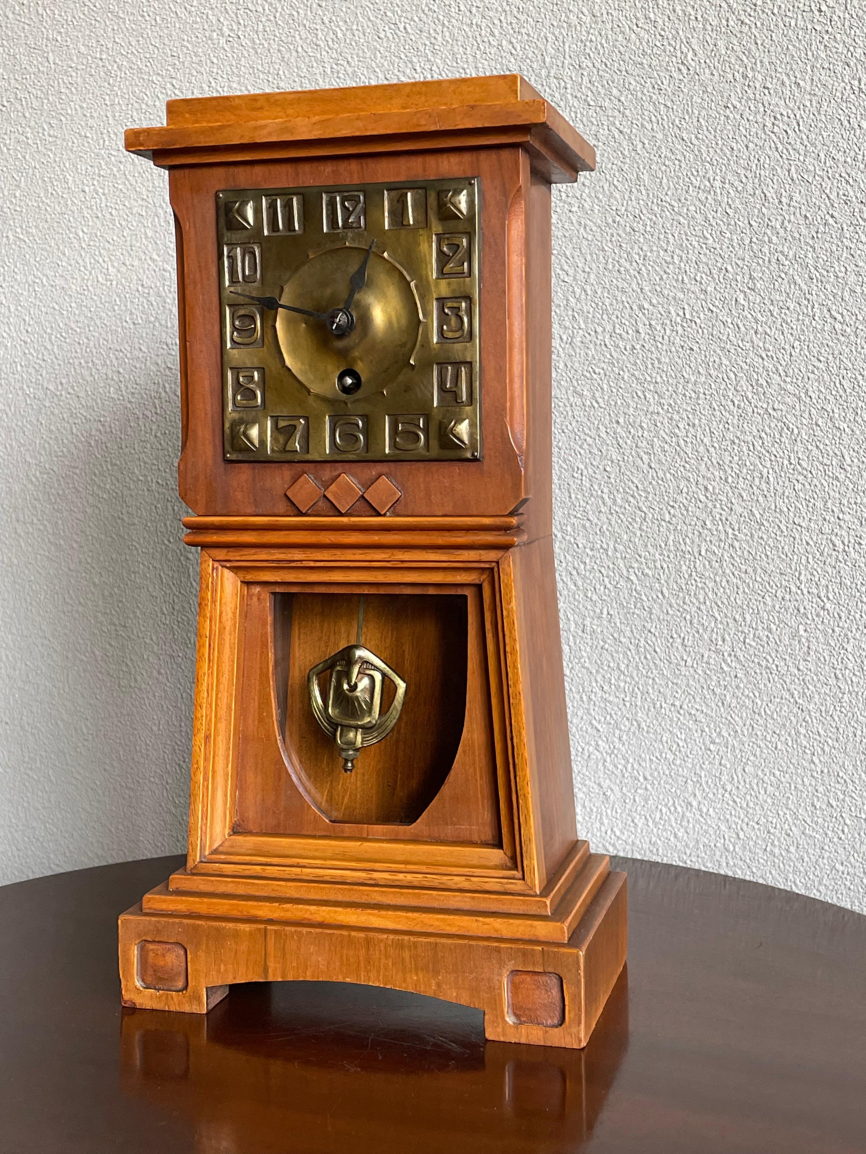 Metal Arts and Crafts Nutwood Mantel or Table Clock with an Embossed Brass Dial Face For Sale