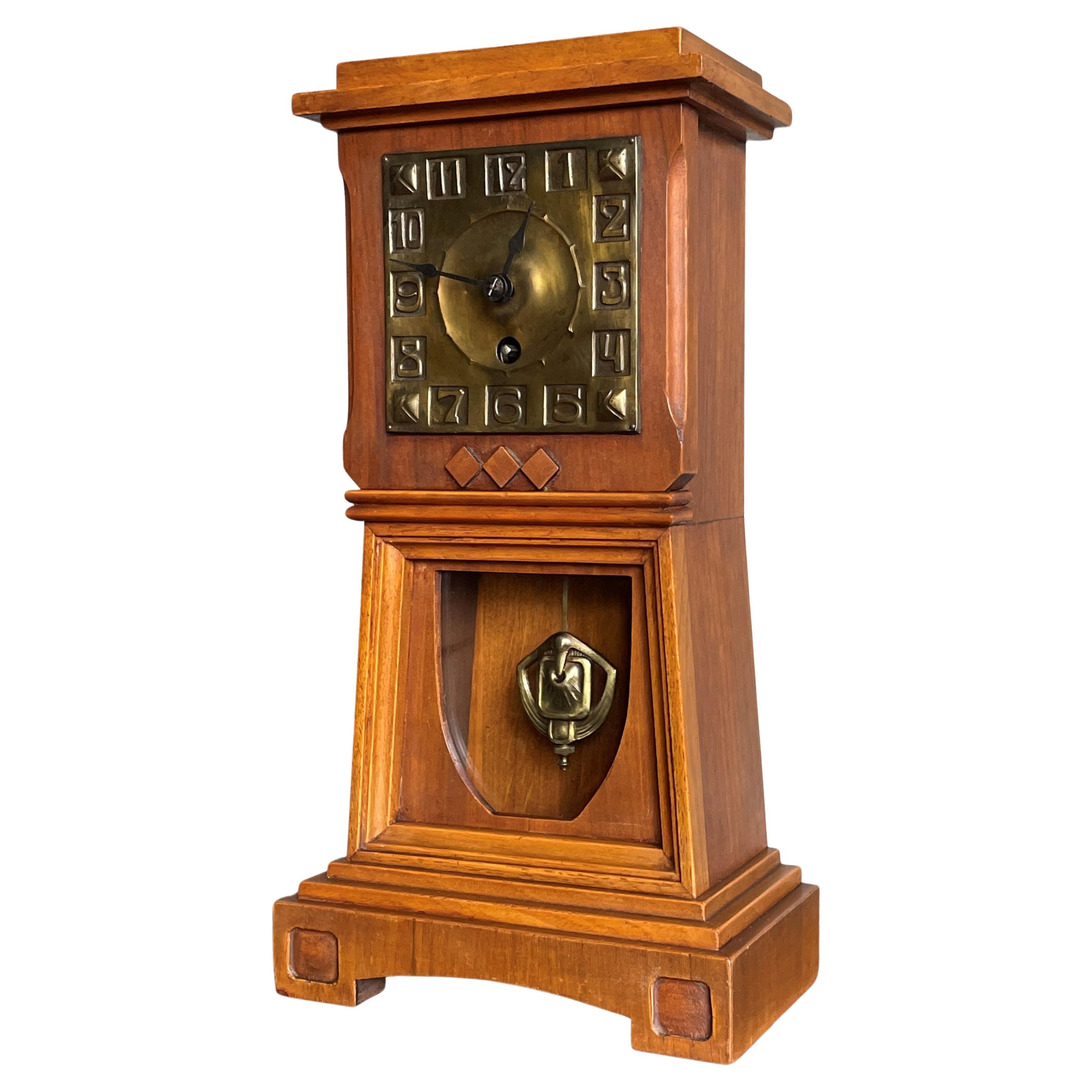 Arts and Crafts Nutwood Mantel or Table Clock with an Embossed Brass Dial Face For Sale