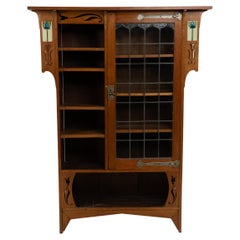 Arts and Crafts Oak Glazed Bookcase with inset period tiles