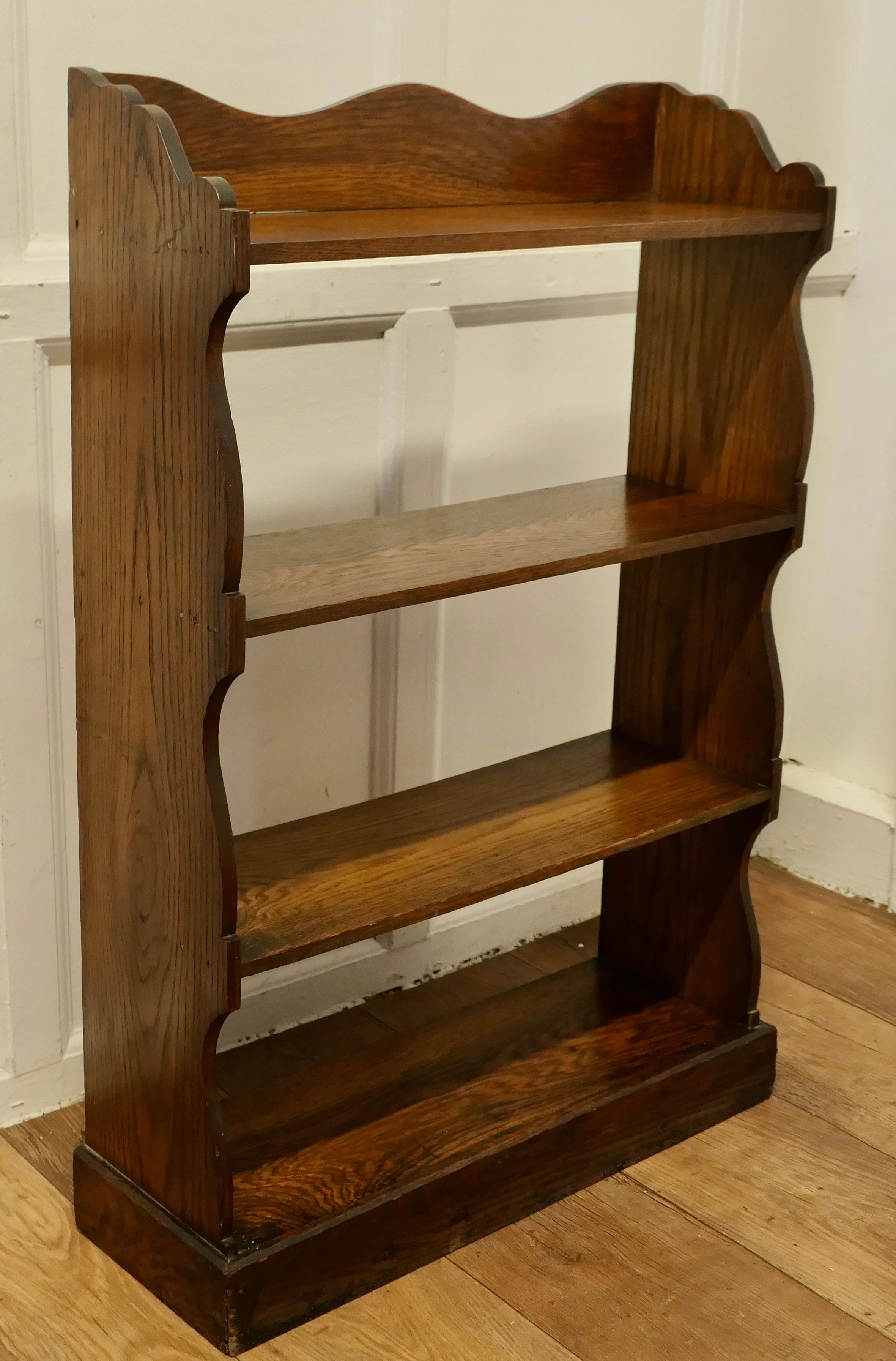 Arts and Crafts Oak Open Front Bookcase.

This Oak bookcase has 4 open shelves and there is a gallery around the top, all the edges of the bookcase are shapely in the arts an crafts style
The bookcase is in good attractive sturdy condition and would