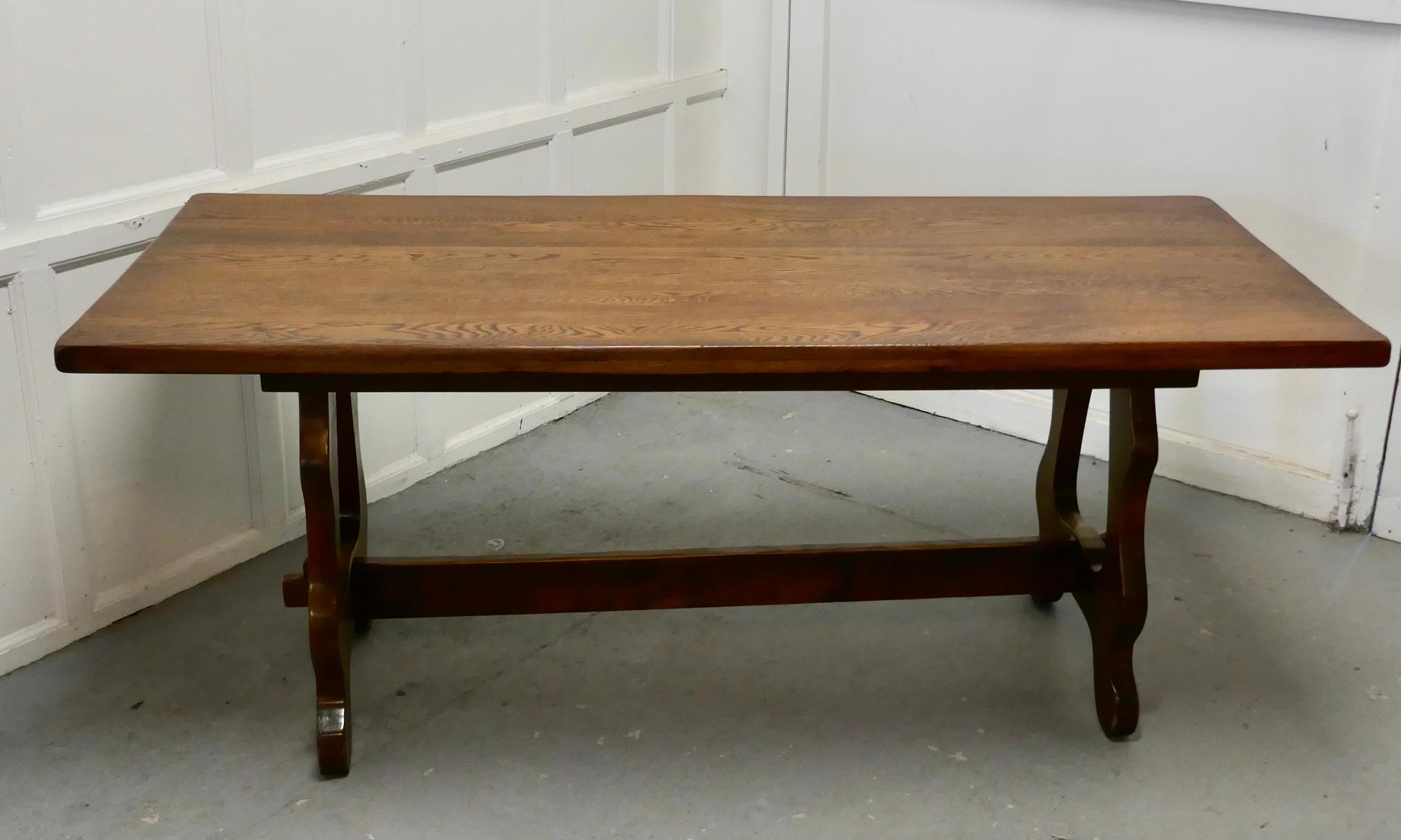 Arts & Crafts oak refectory table 

Oak refectory, this is a great table, the top is in 2” thick Oak, with splendid patina 
The table legs are a lyre design, the top can be removed for ease of transport it is sound and does not wobble
The table