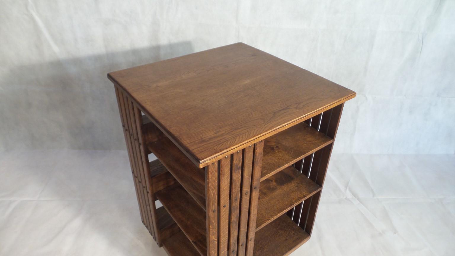 This really is a wonderful oak bookcase from the Art & crafts period of design. With its stylish and simple lines it embraces the very ethos of the Arts & Crafts movement. 

This was welcomed as simple design, beautiful materials and honest,