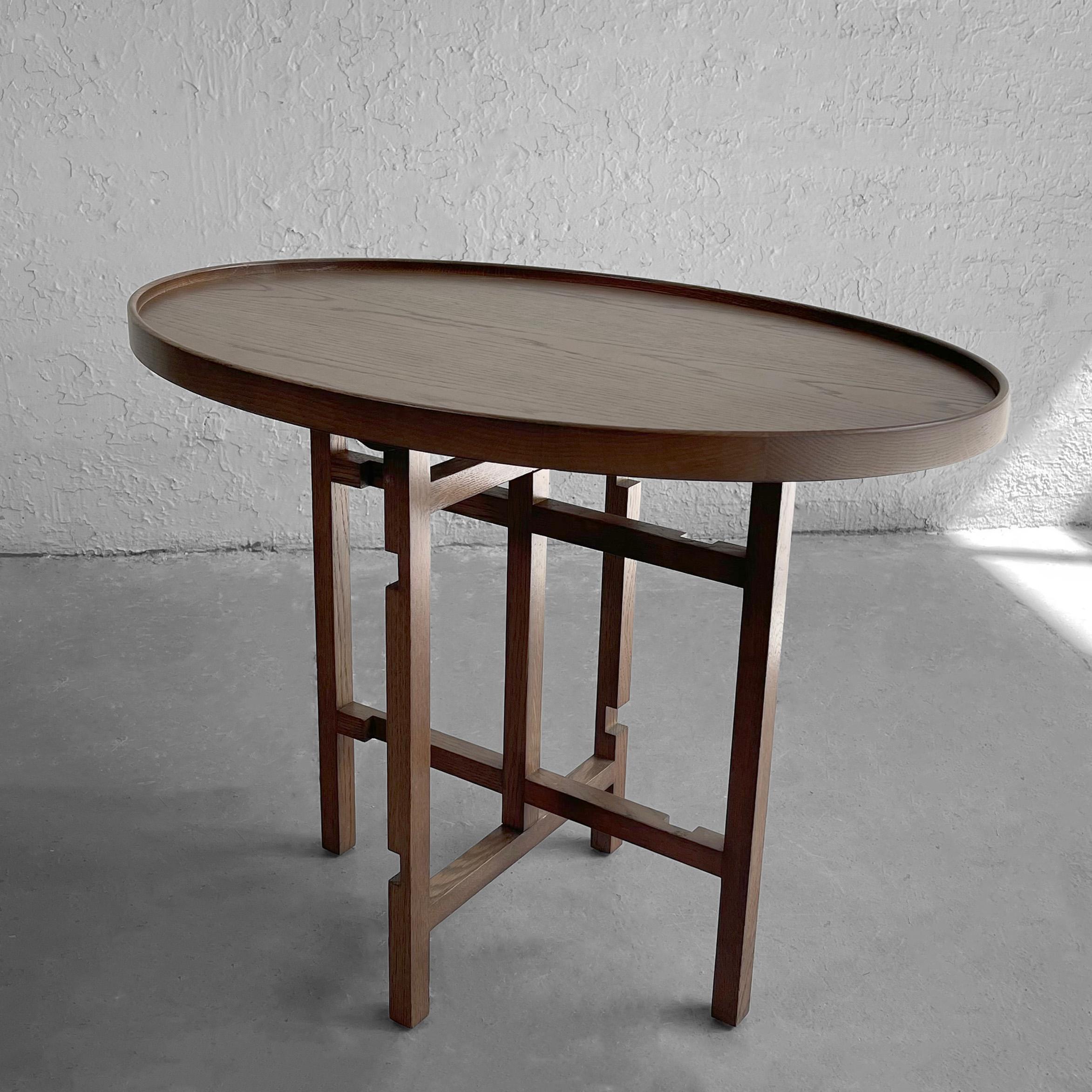 Art and crafts, craftsman-made, walnut side table features a recessed oval top with intersecting, latticed base. It's an interesting little accent table that works for many different applications and decors. 