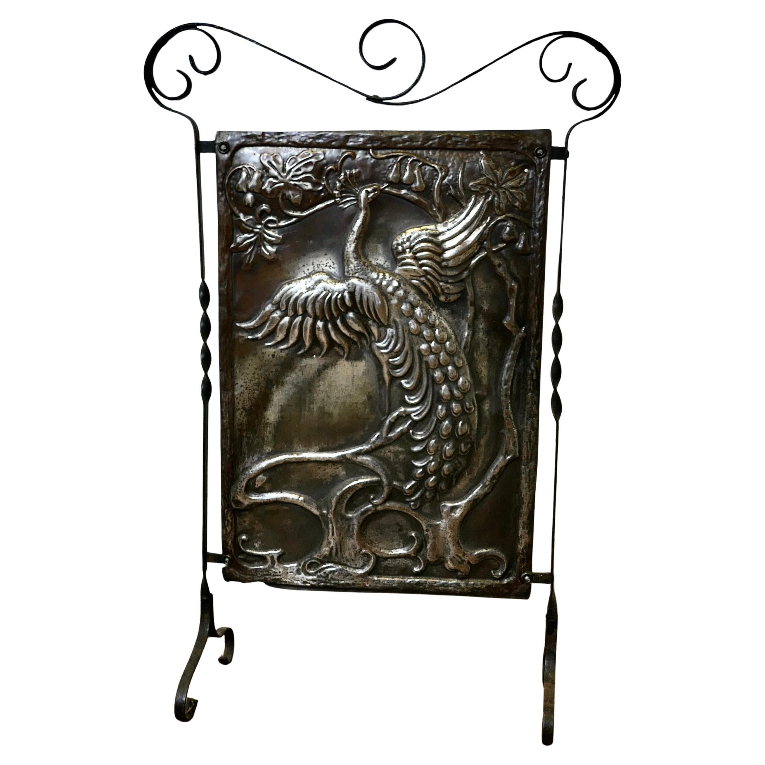 Arts and Crafts Peacock Design Polished Iron Fire Screen This is a Classic For Sale