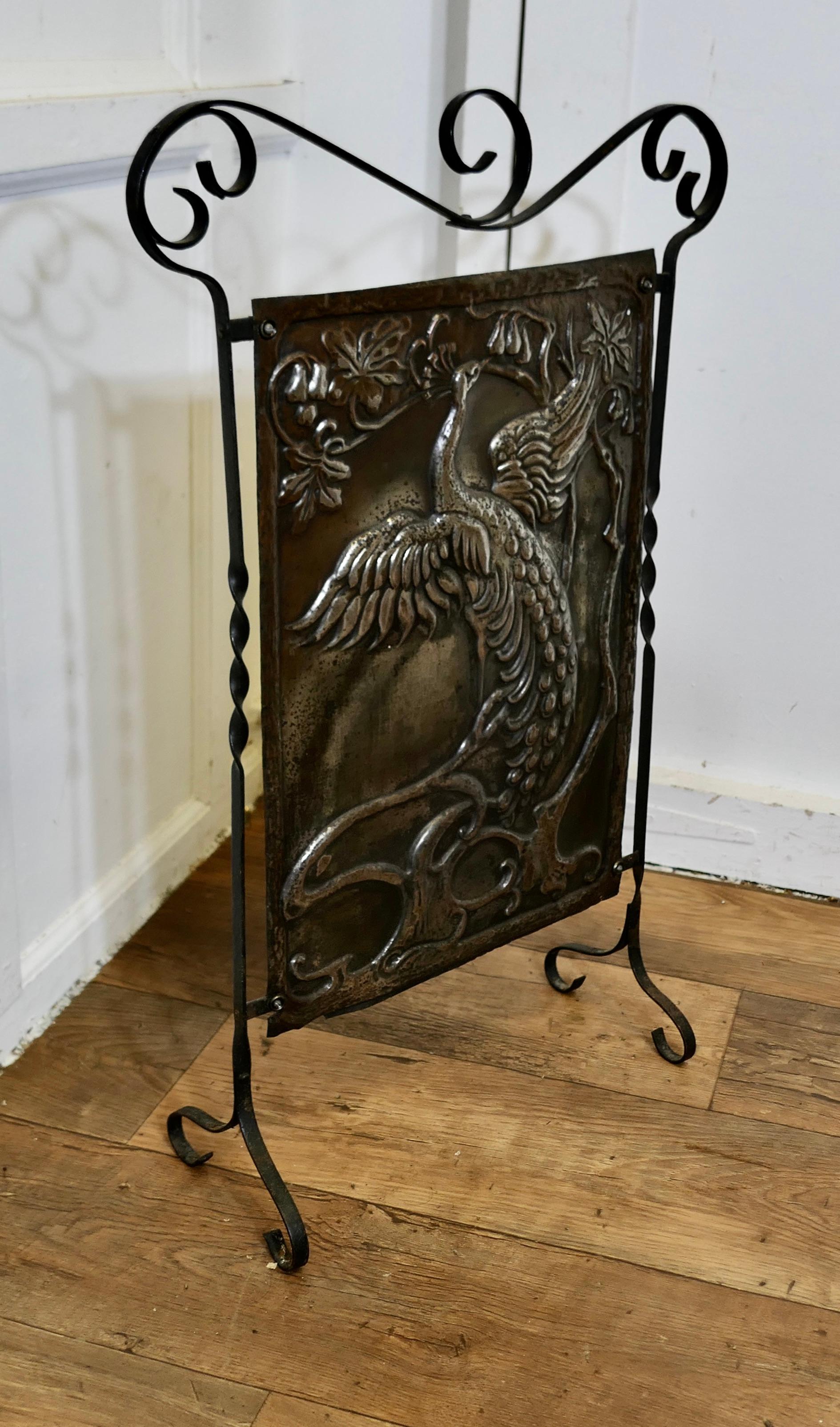 Late 19th Century Arts and Crafts Peacock Polished Iron Fire Screen  This is a Classic For Sale