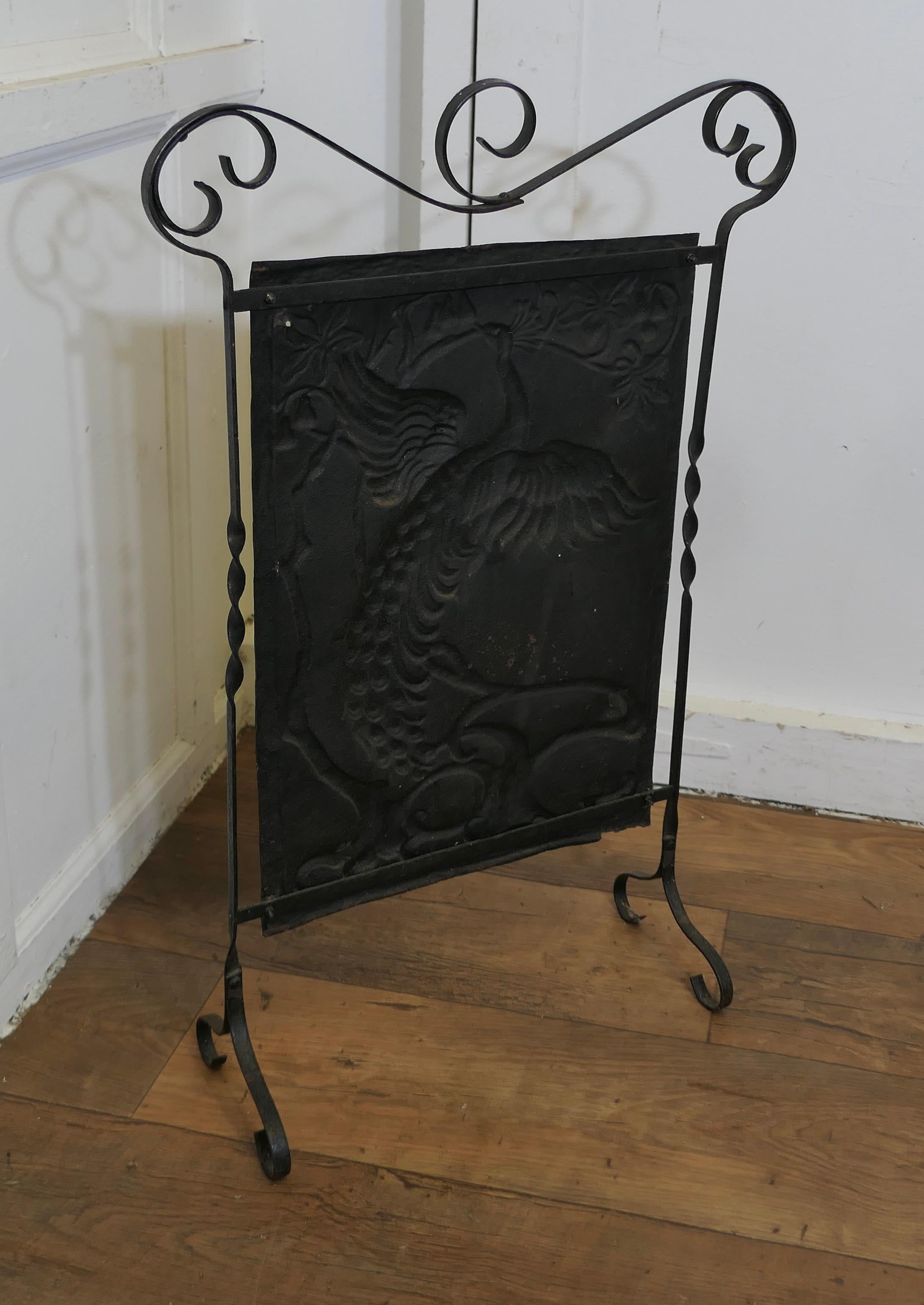 Steel Arts and Crafts Peacock Polished Iron Fire Screen  This is a Classic For Sale
