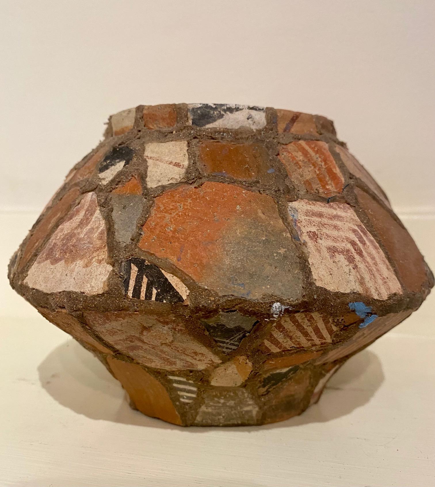 Unique Arts and Crafts period Southwestern pot made from Ancient Anasazi Shards, circa 1910. A hand molded earthenware Olla that has been covered with a mosaic of Pre-Historic Anasazi pottery shards. The Anasazi were ancient pueblo dwellers (circa