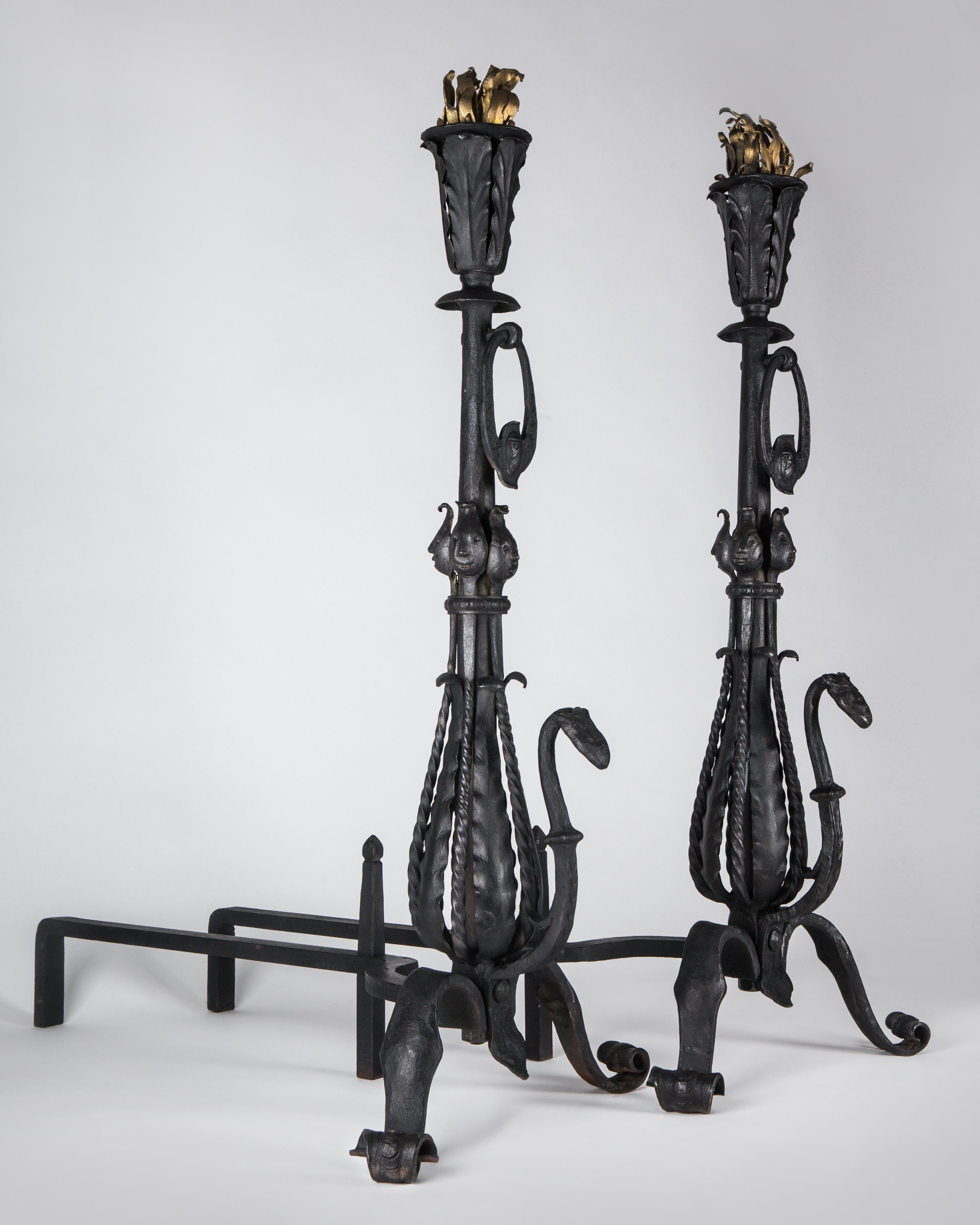AFP0605

A pair of antique Arts & Crafts period wrought iron andirons with figural and leaf-form elements. Having scrolled feet, terminating in flaming torch finials,
circa 1920

Dimensions:
Overall: 40-1/4