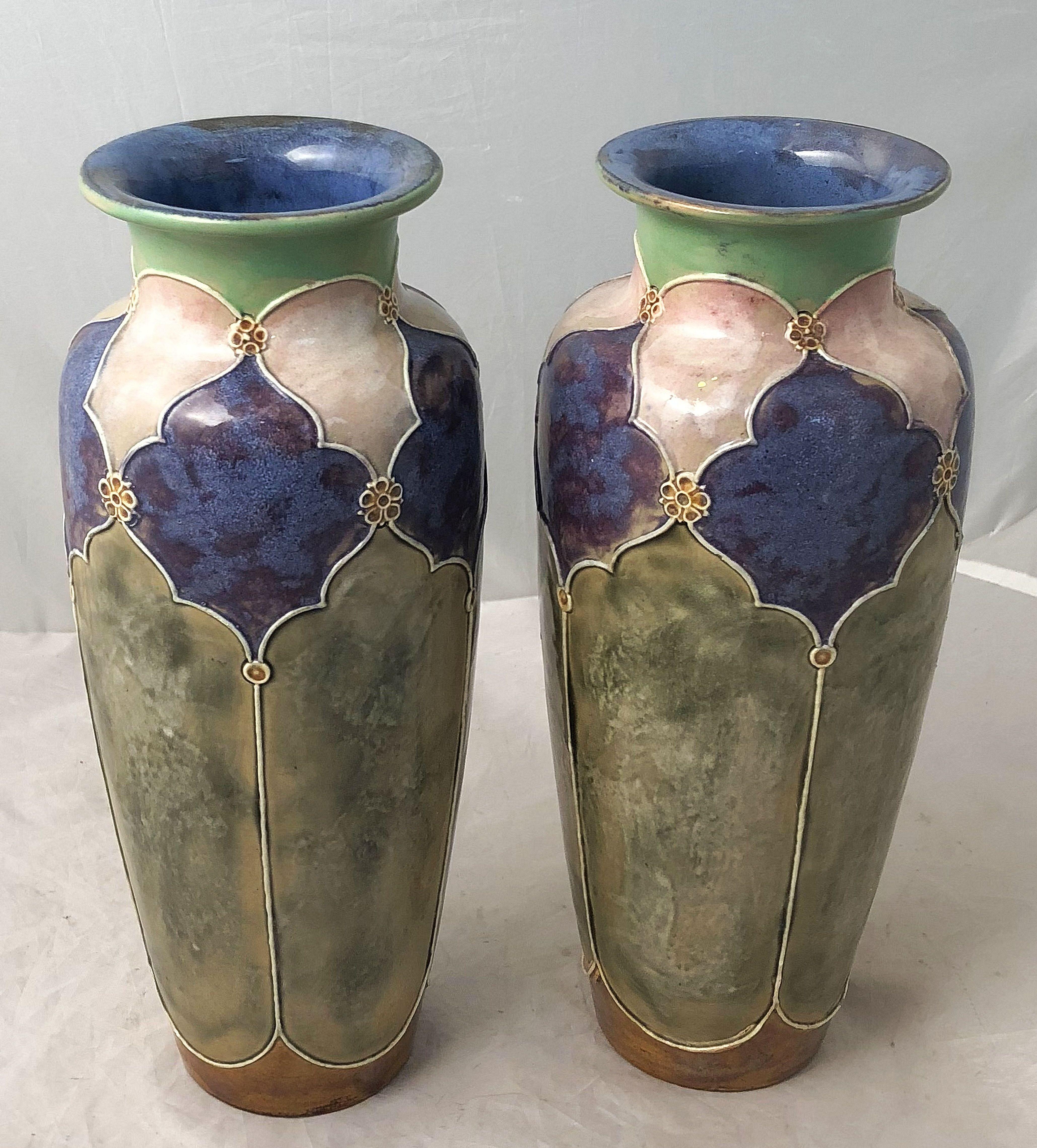 A Fine pair of decorative ceramic vases from the Arts & Crafts period, by the celebrated English pottery firm, Royal Doulton. 
Each vase featuring a Moorish design around the circumference. 
Impressed mark to base.

Priced as a pair - $1895 the