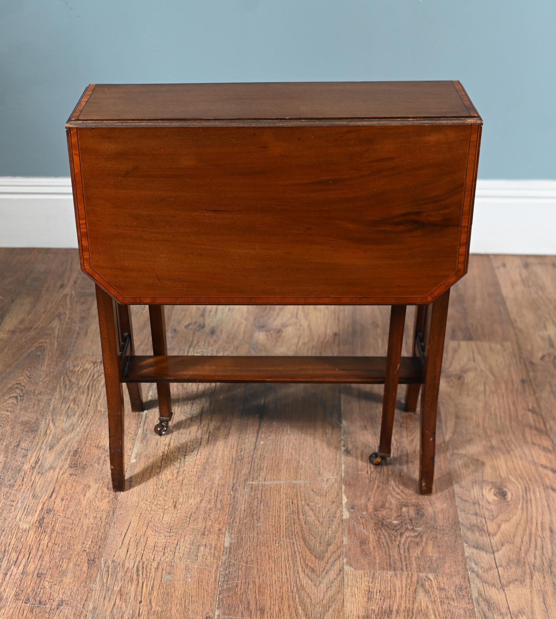 You are viewing a gorgeous Arts and Crafts drop leaf table
Ideal for use as a lamp, wine, or occasional table
Circa 1910 and crafted from mahogany
Viewings available by appointment
he rectangular top features two hinged leaves that fold down when