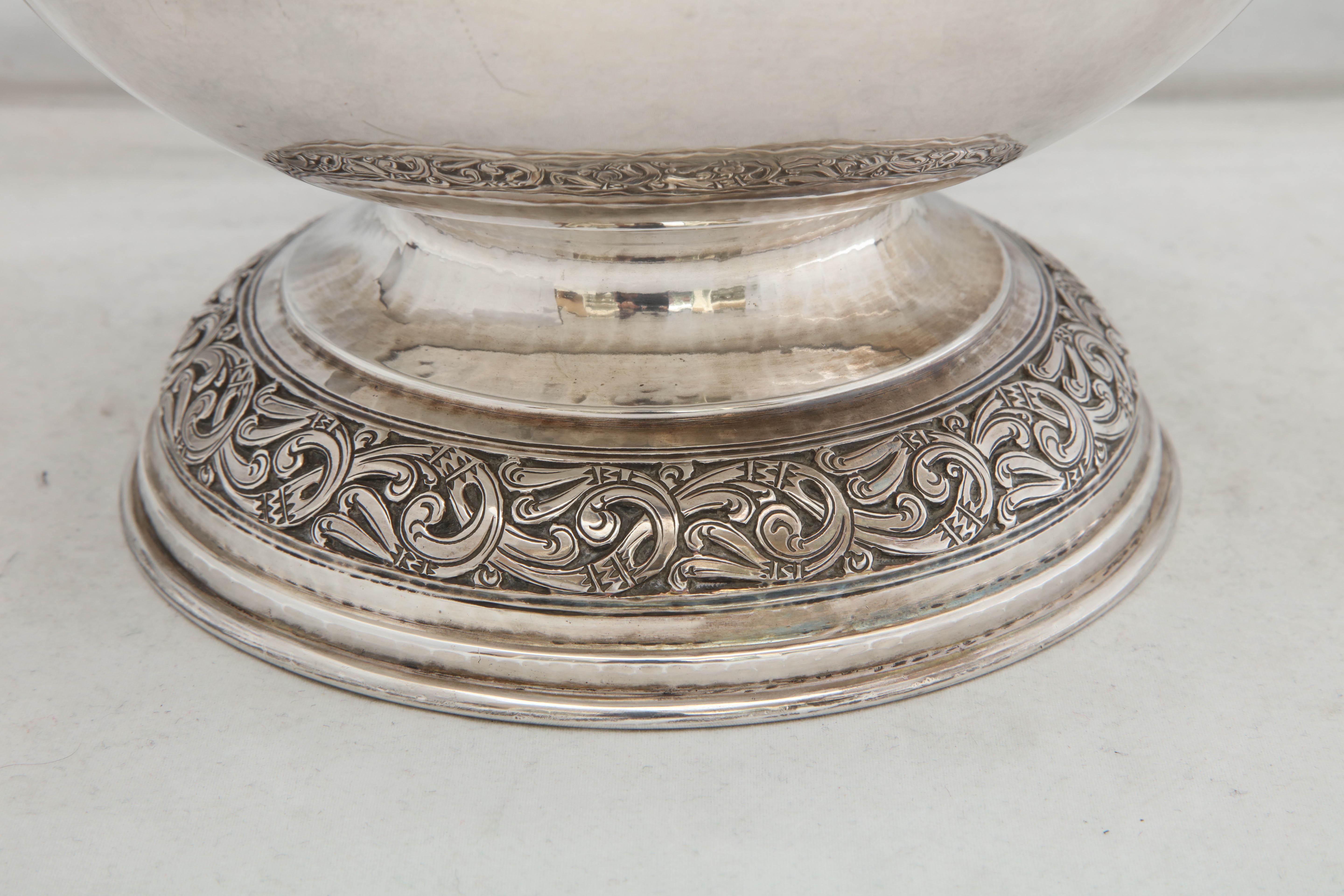 Arts and Crafts Sterling Silver Celtic-Style pedestal-based  bowl, Birmingham, England, 1913, Liberty and Company - makers. Lightly hammered. Celtic designs on upper border of bowl and on base. Measures 6 1/2 inches high x 9 inches diameter. Weighs
