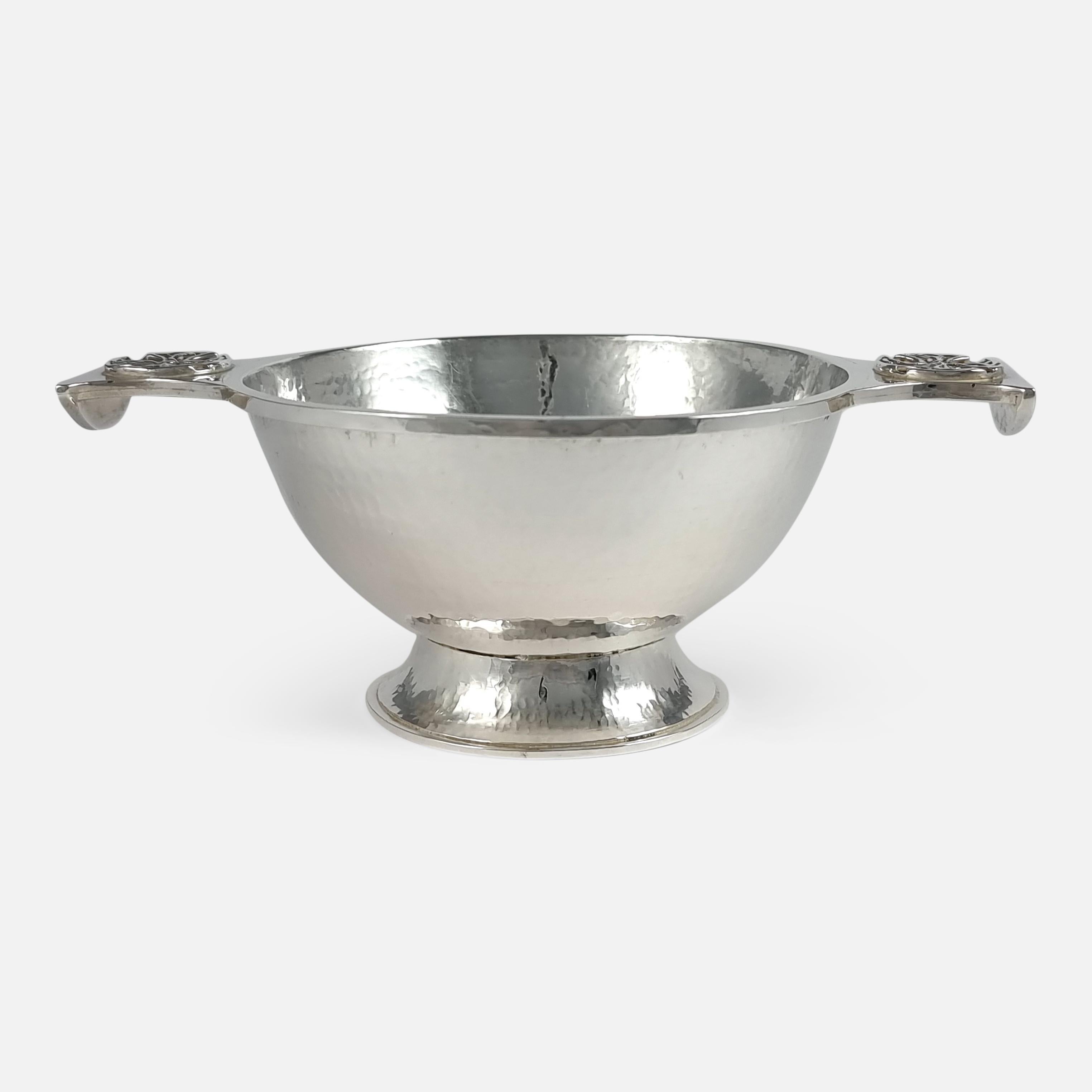 A sterling silver Quaich in the Arts and Crafts style, hallmarked London, 1933, and made by highly collectable inter-war jeweller and silversmith Sibyl Dunlop. The Quaich is of circular spot hammered form, with Celtic roundels applied to the