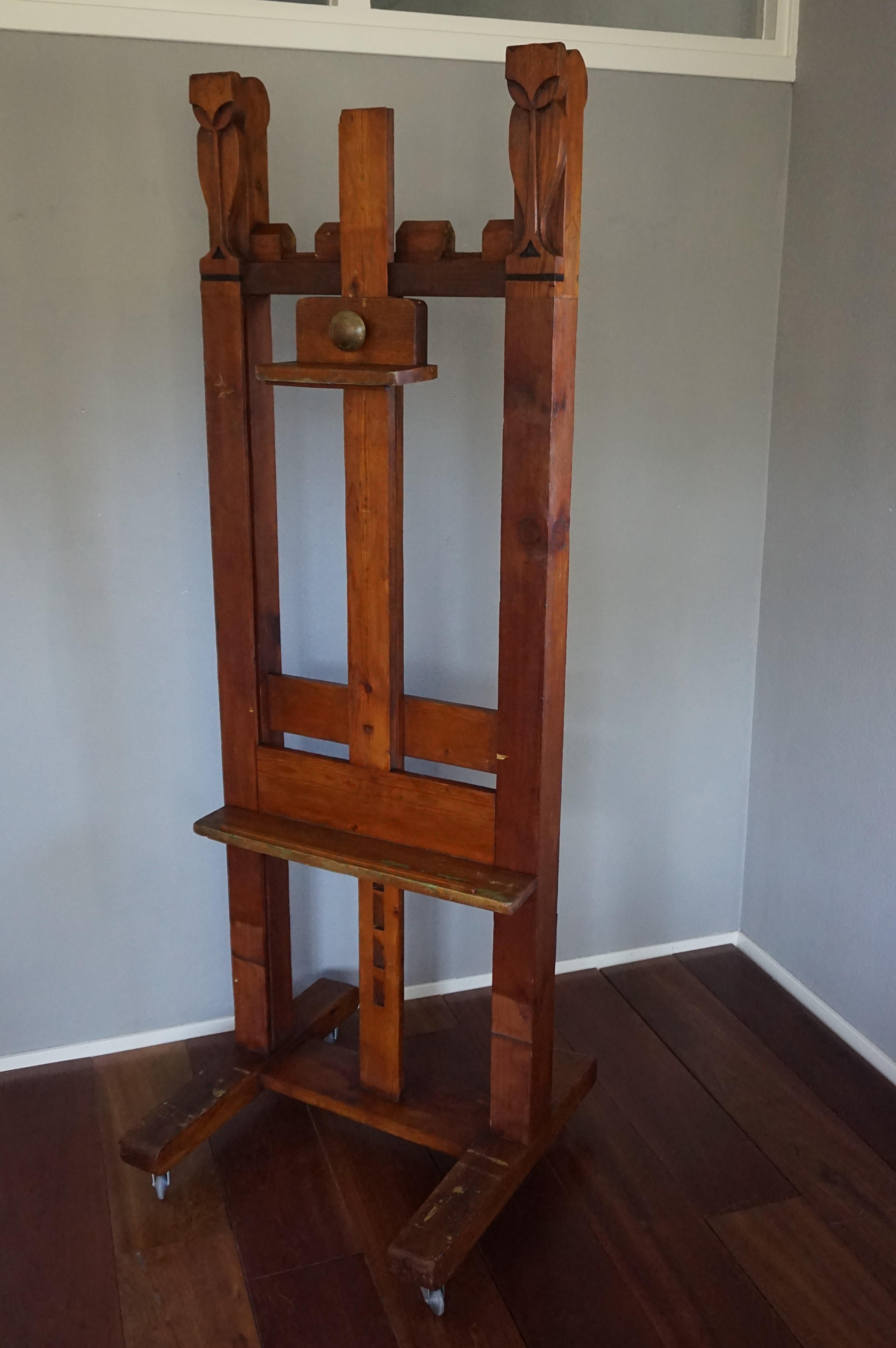 One of a kind, early 1900s decorative art floor easel.

This unique easel was all handcrafted around the turn of the century and it is the first studio easel that we have ever seen with integrated sculptures. For those sculptures to be a pair of