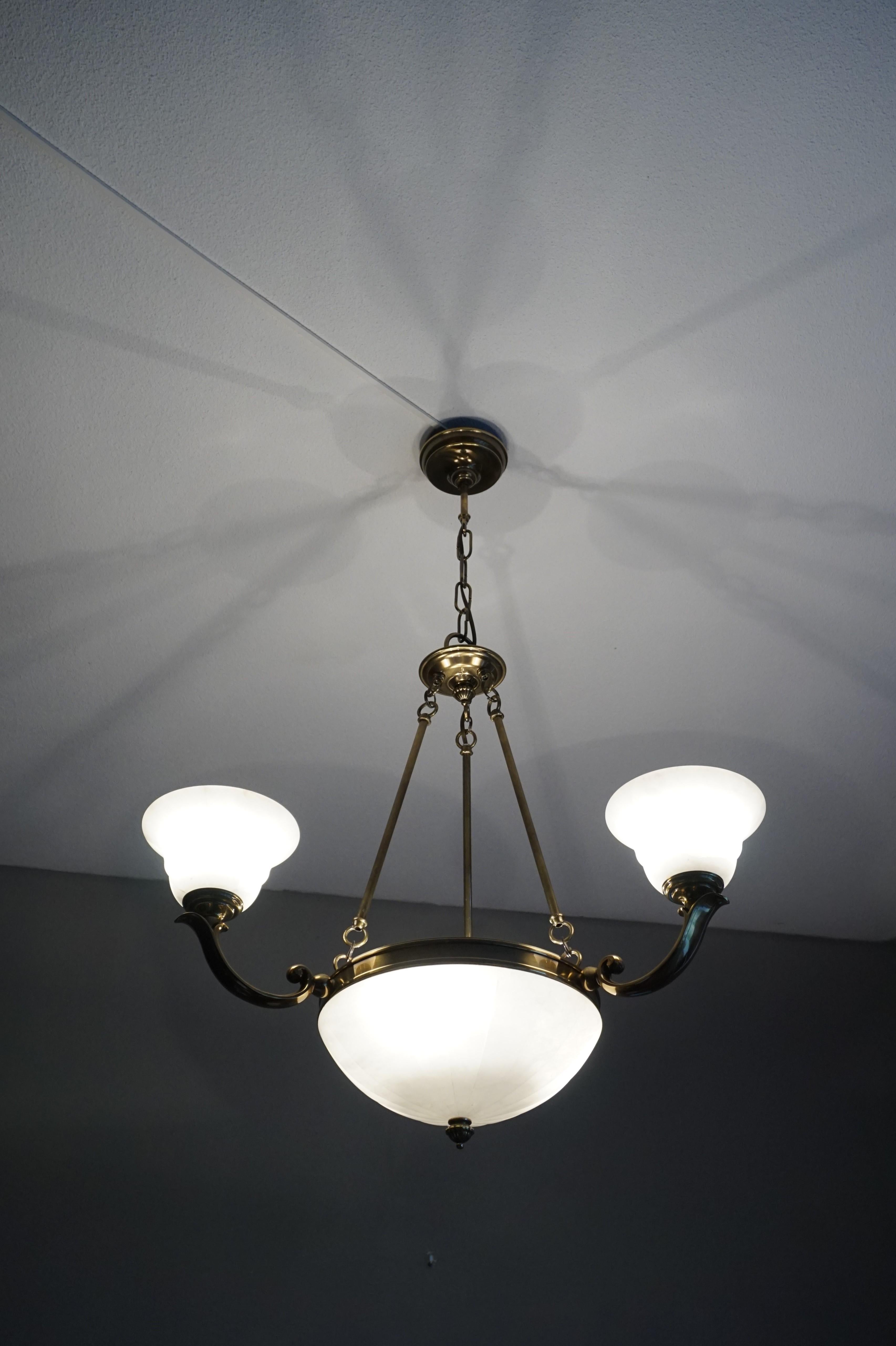 Excellent condition and rare design, 6-light chandelier.

If you like Arts & Crafts light fixtures, but you prefer to have them shiny like new, then this 1970s alabaster, bronze and brass chandelier could be perfect for you. The combination of the