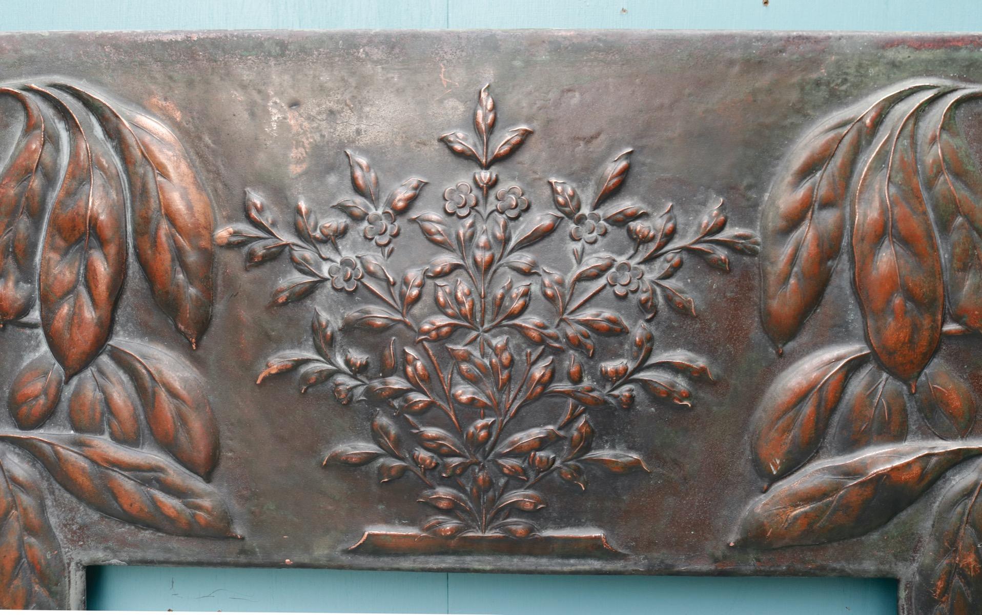 A reclaimed Arts and Crafts style copper fireplace insert with repoussé foliage decoration.

Additional dimensions

Opening height 76 cm

Opening width 49 cm.