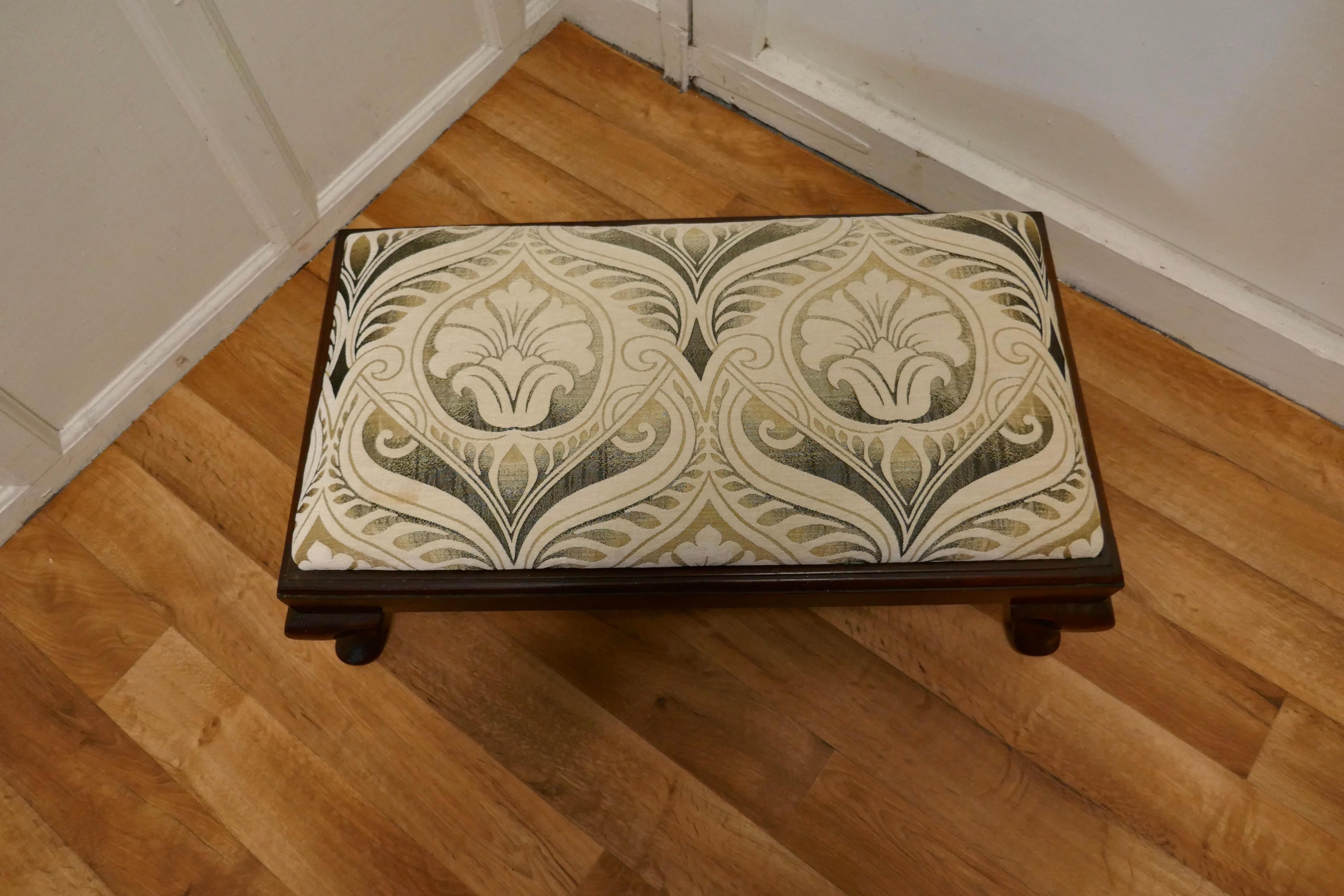Arts and Crafts Style Upholstered Long Foot Stool 

A Lovely piece standing on Cabriole legs and the deep seat is upholstered in a stunning Arts and Crafts style designer fabric detailed in velvet and shimmering pearlescent thread

The stool is