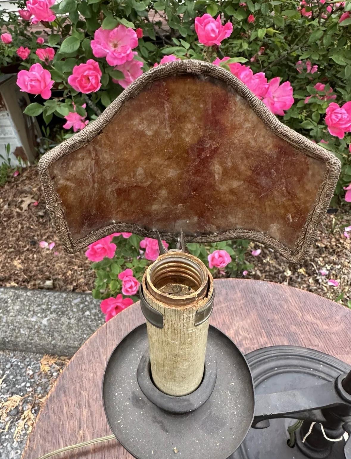 Arts And Crafts Table Lamp - Stickley era with PERIOD MICA - W2219

This is an antique Arts & Crafts table lamp with original wrought iron base and original patina. The shades are period mica, NOT reproduction.

WE RUNNING A SPECIAL SALE