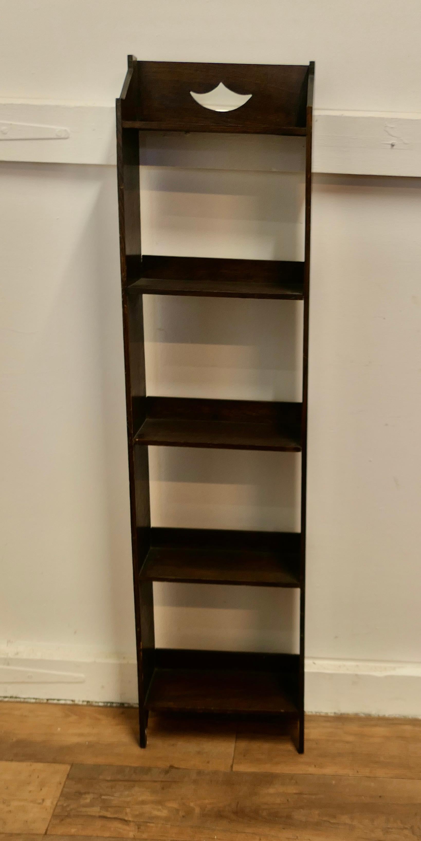 Arts and Crafts Tall Slim Open Front Oak Bookcase.

This Oak bookcase has 5 open shelves all with galleries at the back, tall and sturdy a lot of storage in a small space

The bookcase is in good attractive sturdy condition and would work very well