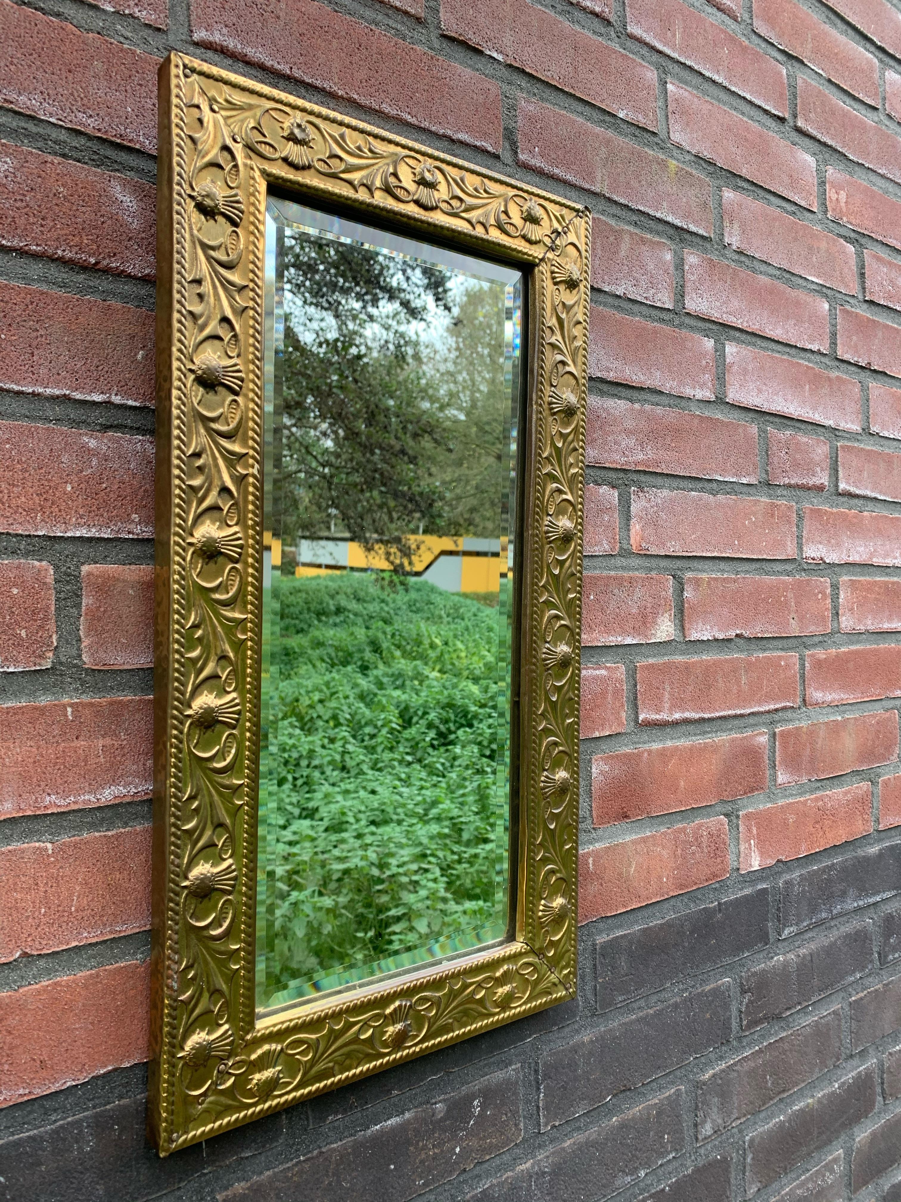 Arts & Crafts Wall Mirror with Stylized and Embossed Brass Thistle Flowers Frame In Good Condition In Lisse, NL