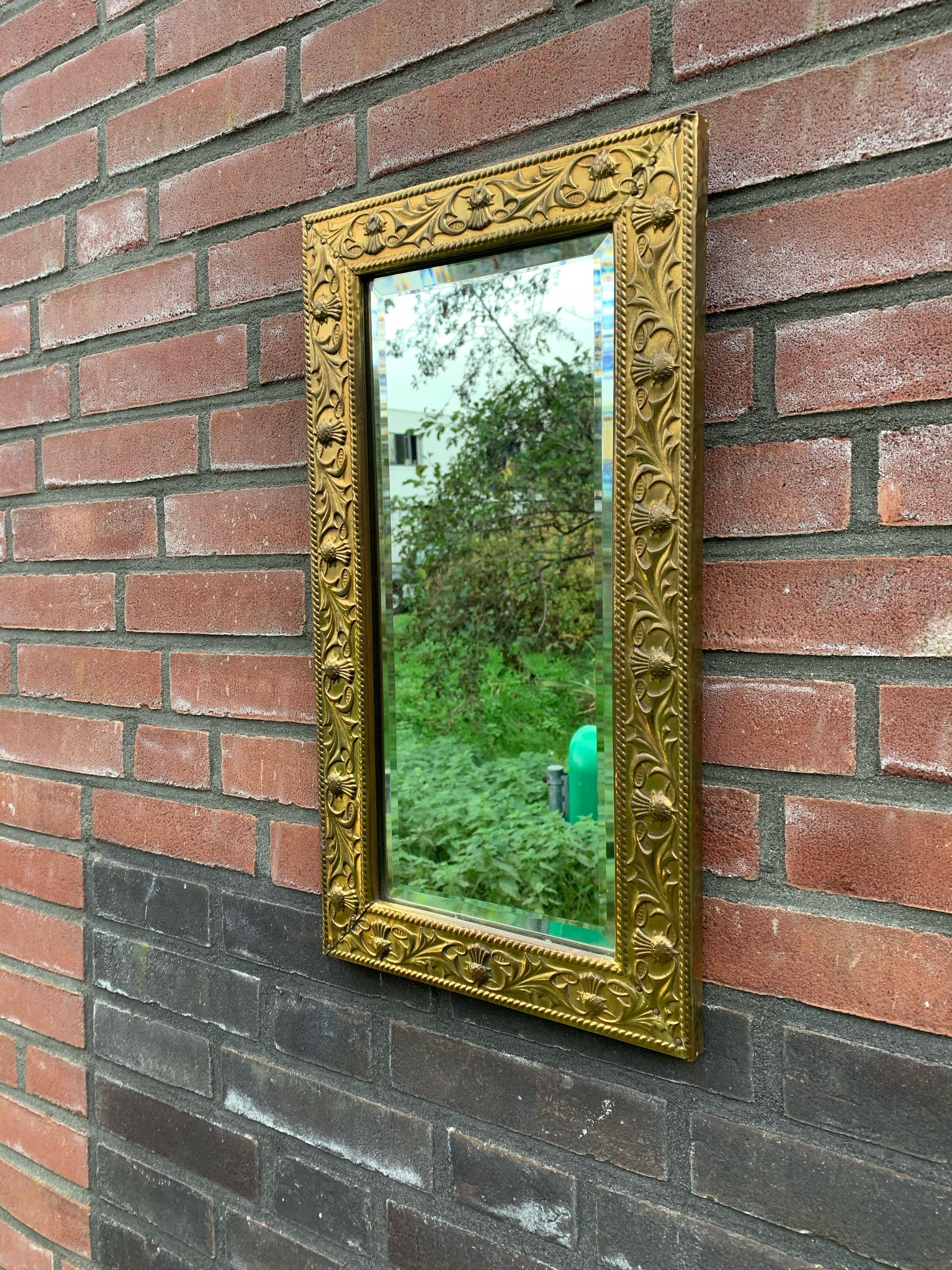 20th Century Arts & Crafts Wall Mirror with Stylized and Embossed Brass Thistle Flowers Frame