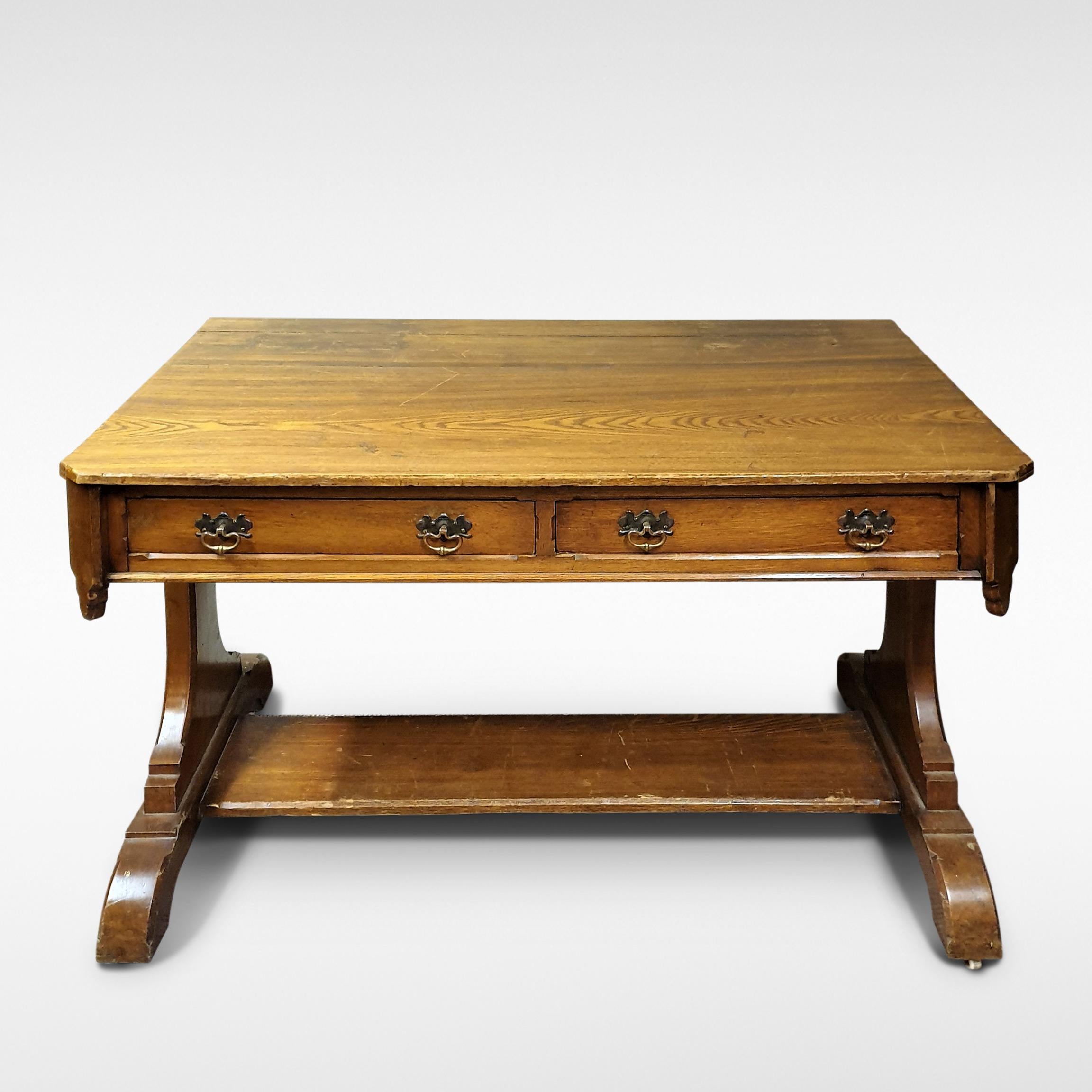 Gothic Revival style Arts & Crafts writing table in pitch pine with trefoil piercings to pedestals, late 19th century

Price includes full restoration using traditional techniques. Please allow 6-8 weeks.