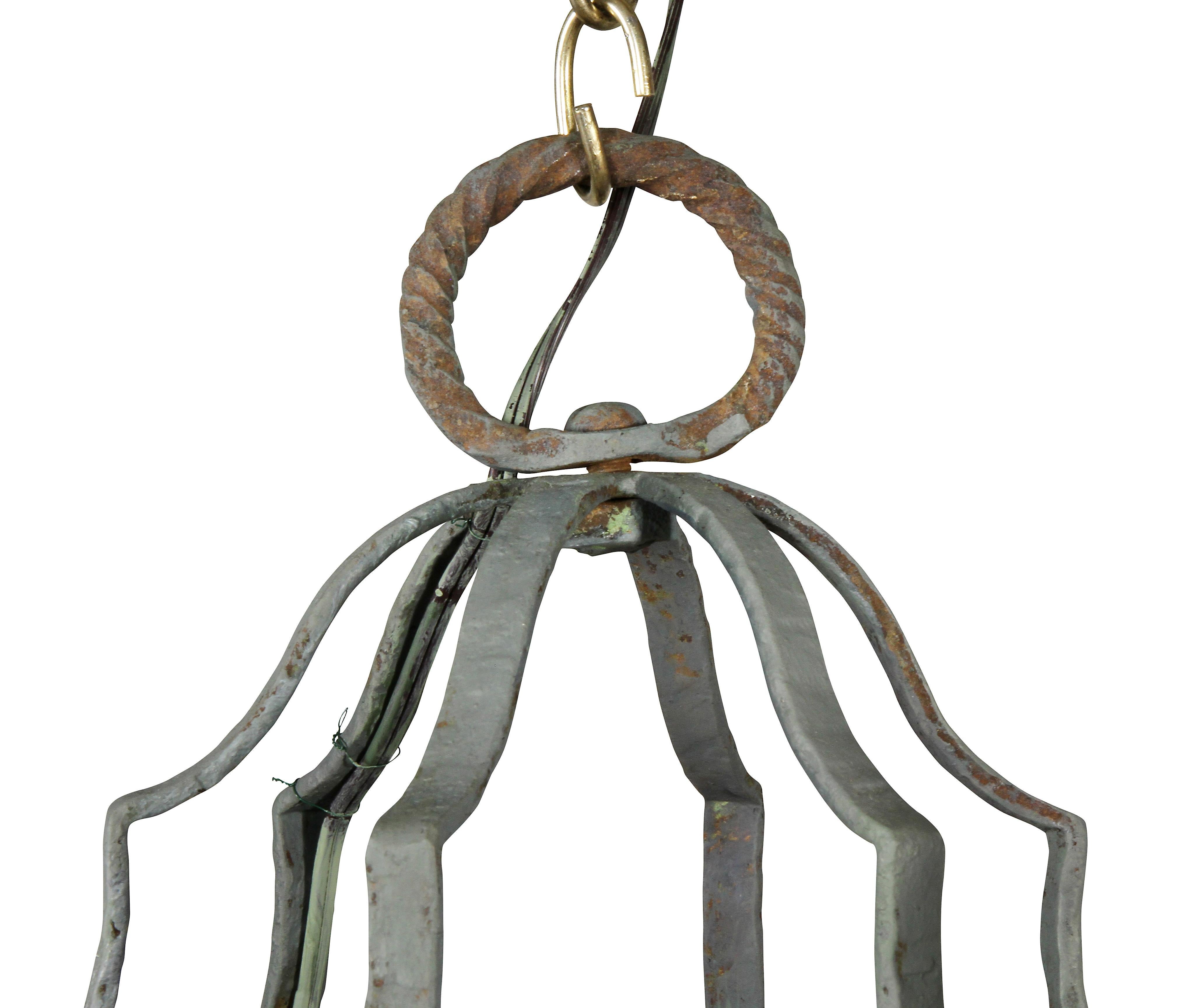 Ring hook with four arms, octagonal frame with rosettes and X-form decoration over mica panels. Six lights.