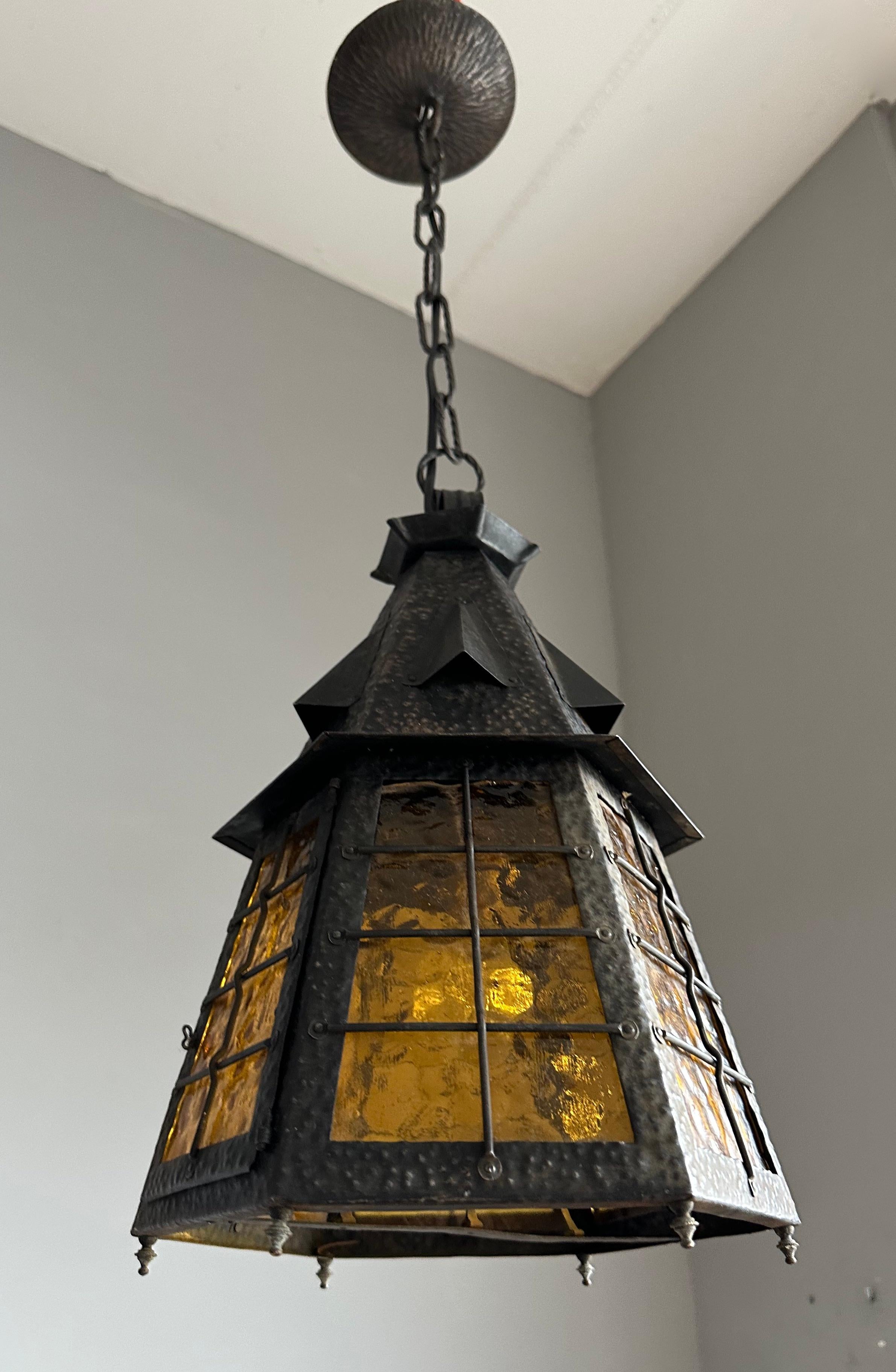 Blown Glass Arts & Crafts Wrought Iron Pendant Light with Cathedral Glass Lantern Pendant For Sale