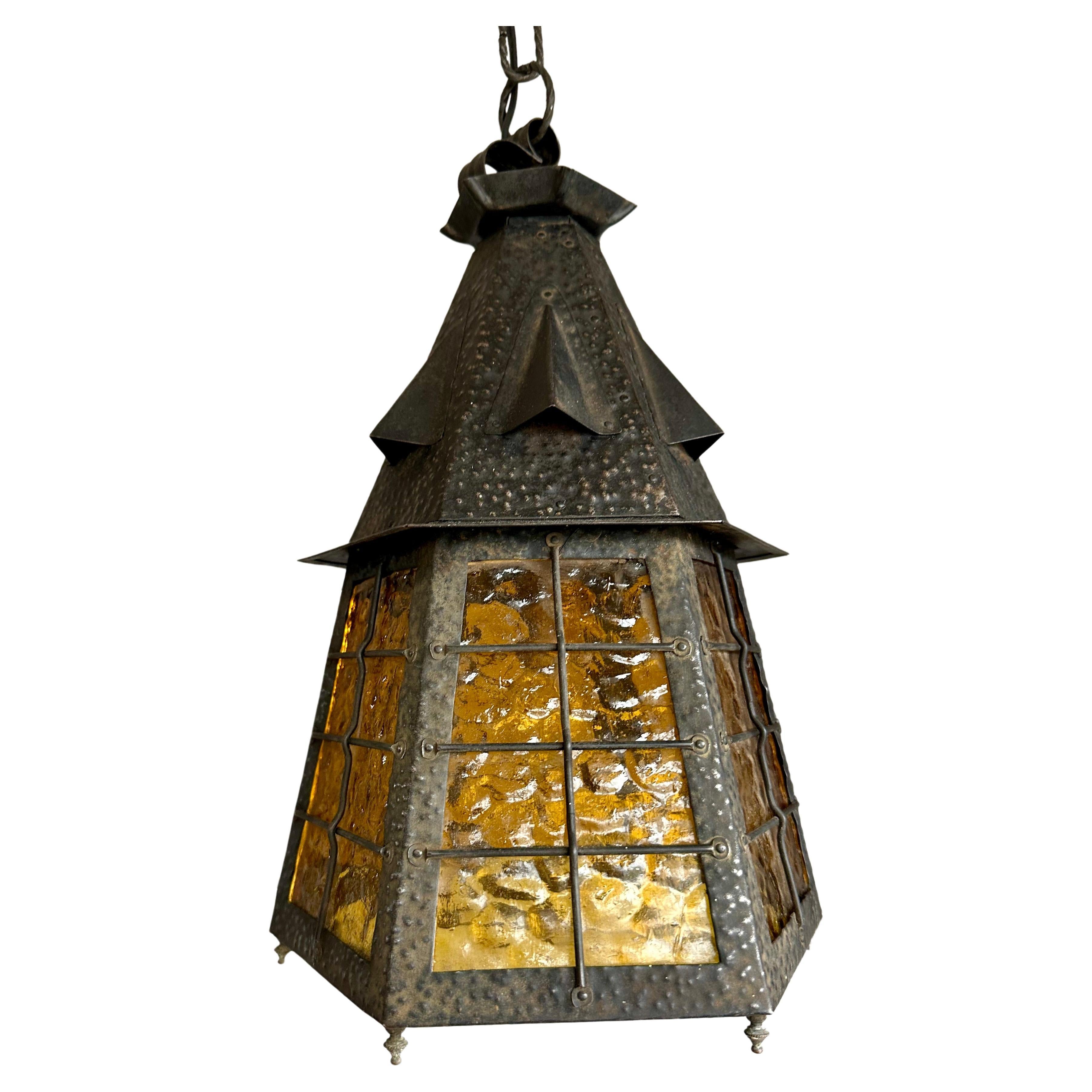 Hammered Arts & Crafts Wrought Iron Pendant Light with Cathedral Glass Lantern Pendant For Sale
