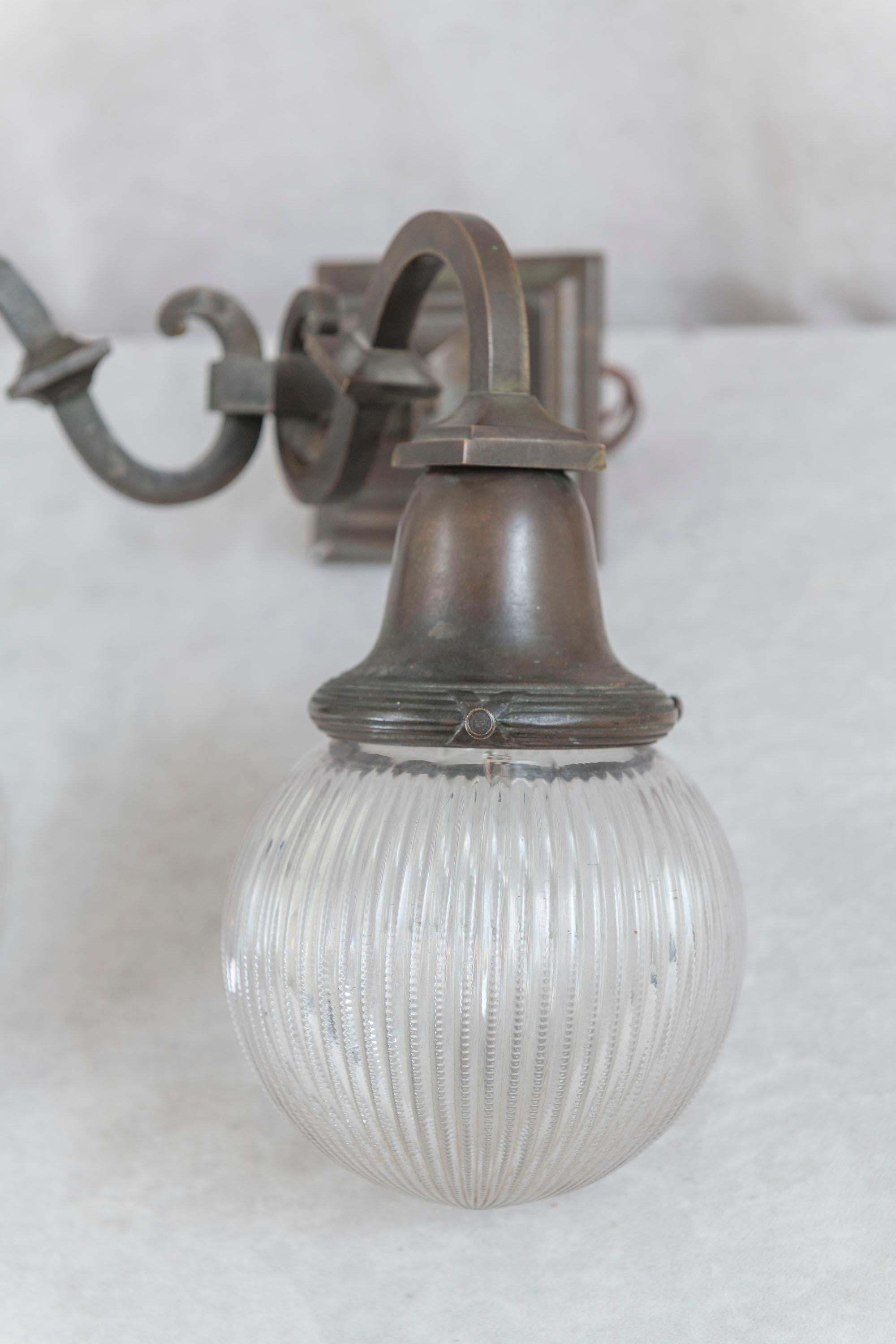 American Arts & Crafts 2 Arm Bronze Sconce w/Holophane Co. Style Glass Shades, ca. 1910 For Sale