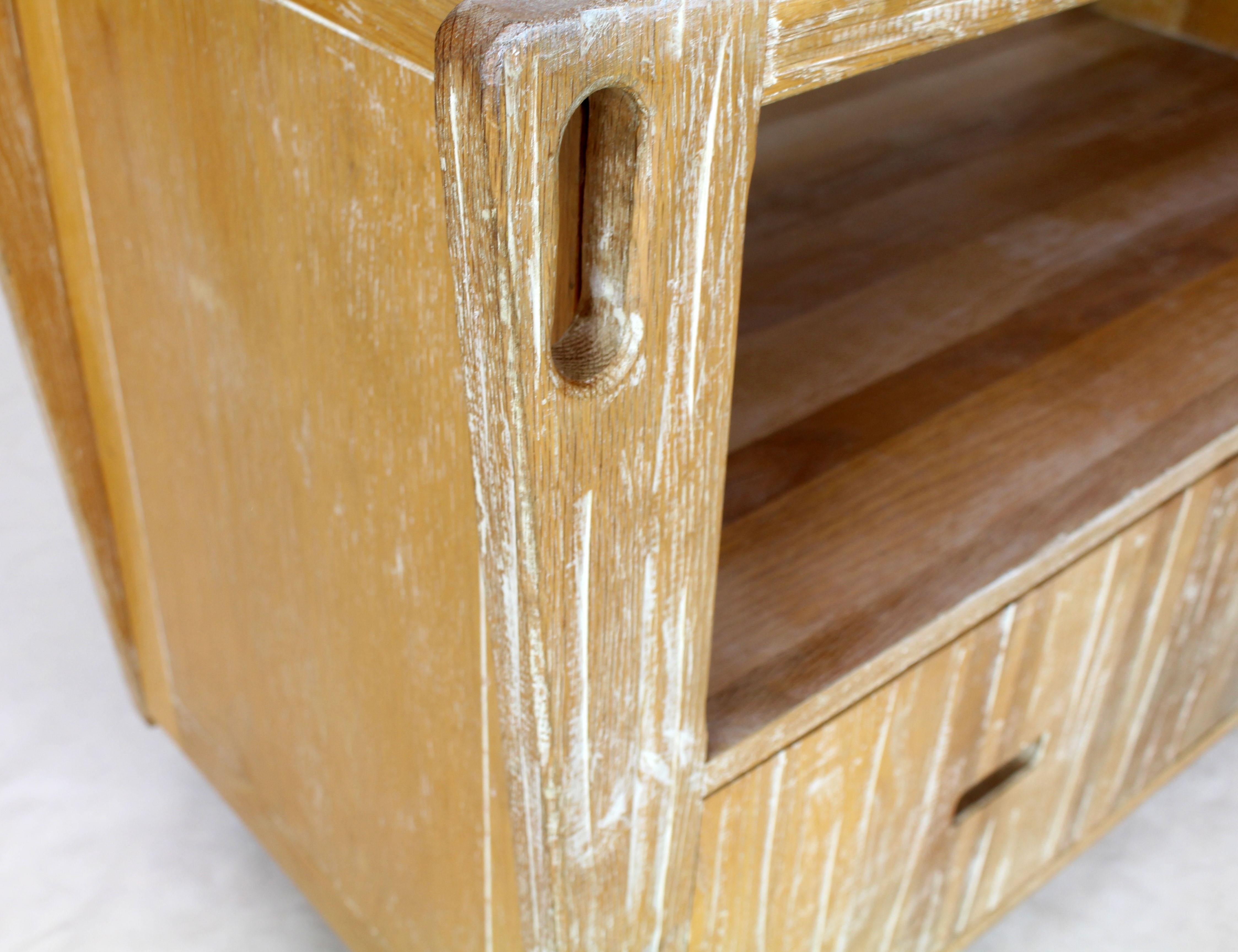 Mid-Century Modern Arts & Crafts style ceruised finish solid oak serving drop-leaf bar or cart on wheels. Double door storage cabinet on the bottom.