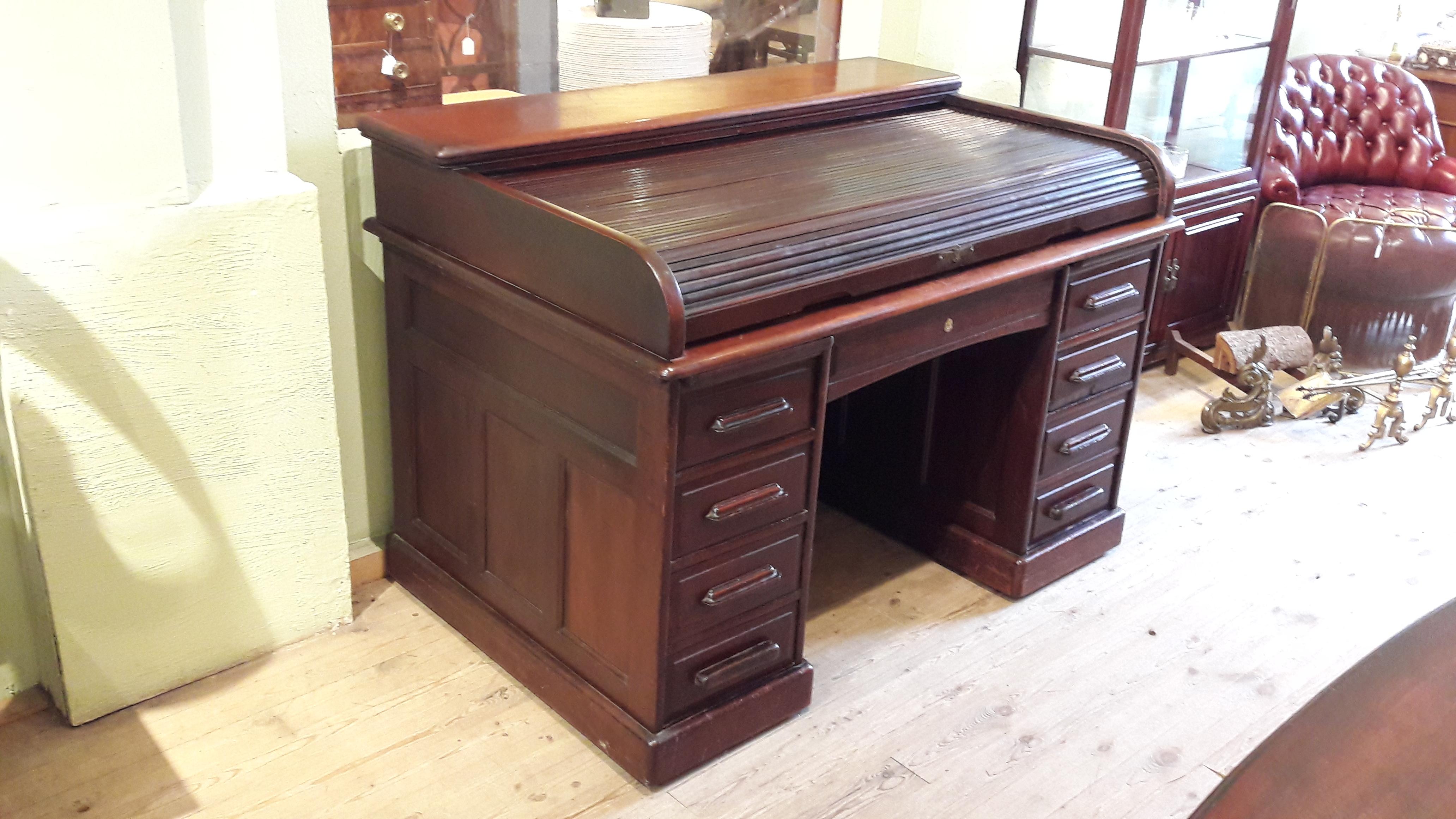 Great mahogany roll top desk. This piece was likely produced in Michigan State for Edgley. You can see on the pictures the 
