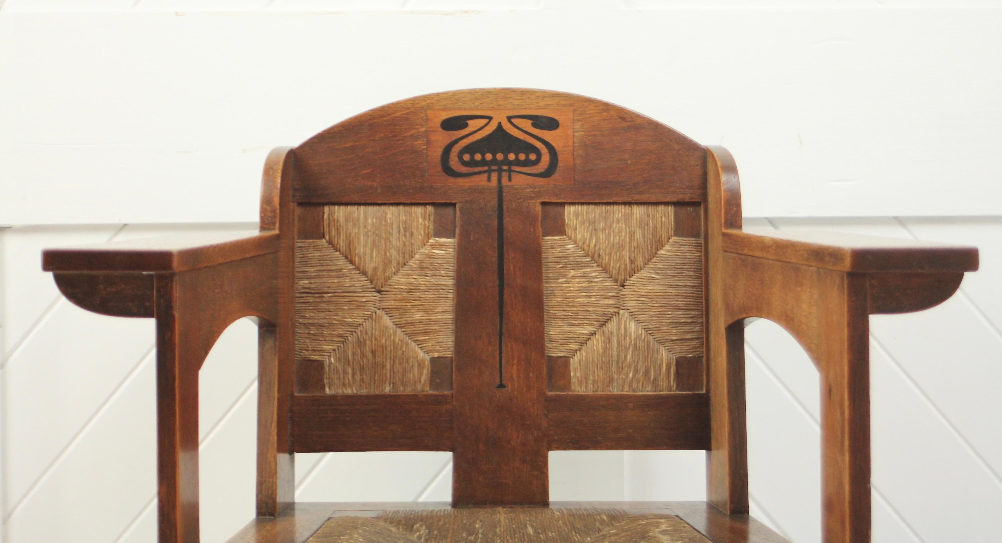 Iconic Arts & Crafts oak armchair

Original rush seat and back panels

Stylised ebony floral decorative inlay

Designed by E G Punnett

For William Birch

Circa 1900

Book image courtesy of: Pictorial Dictionary of British 19th Century Furniture