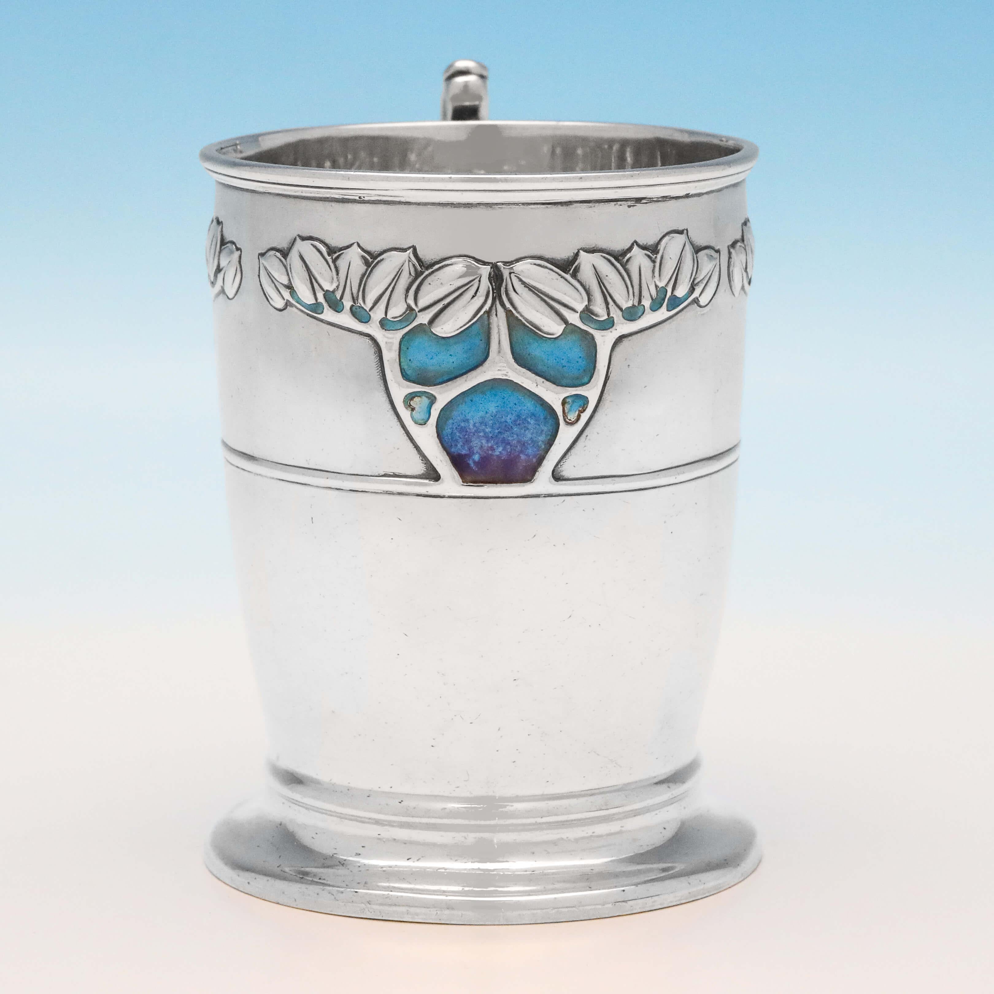 Hallmarked in London in 1903 by George Lawrence Connell, this stunning, Arts & Crafts period, Antique, Sterling Silver Mug, features beautiful Art Nouveau influenced decoration, with tree motifs and attractive purple to light blue enamel work. The
