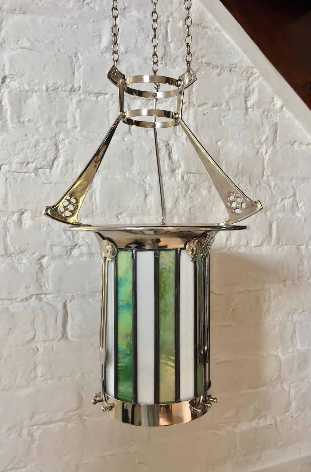 Arts & Crafts lantern with stained glass, English, 1900
This is a beautiful example of top quality craftsmanship. The lantern has in recent years been re-plated in nickel and has also had a new iridescent green and opaque white glass shade made.