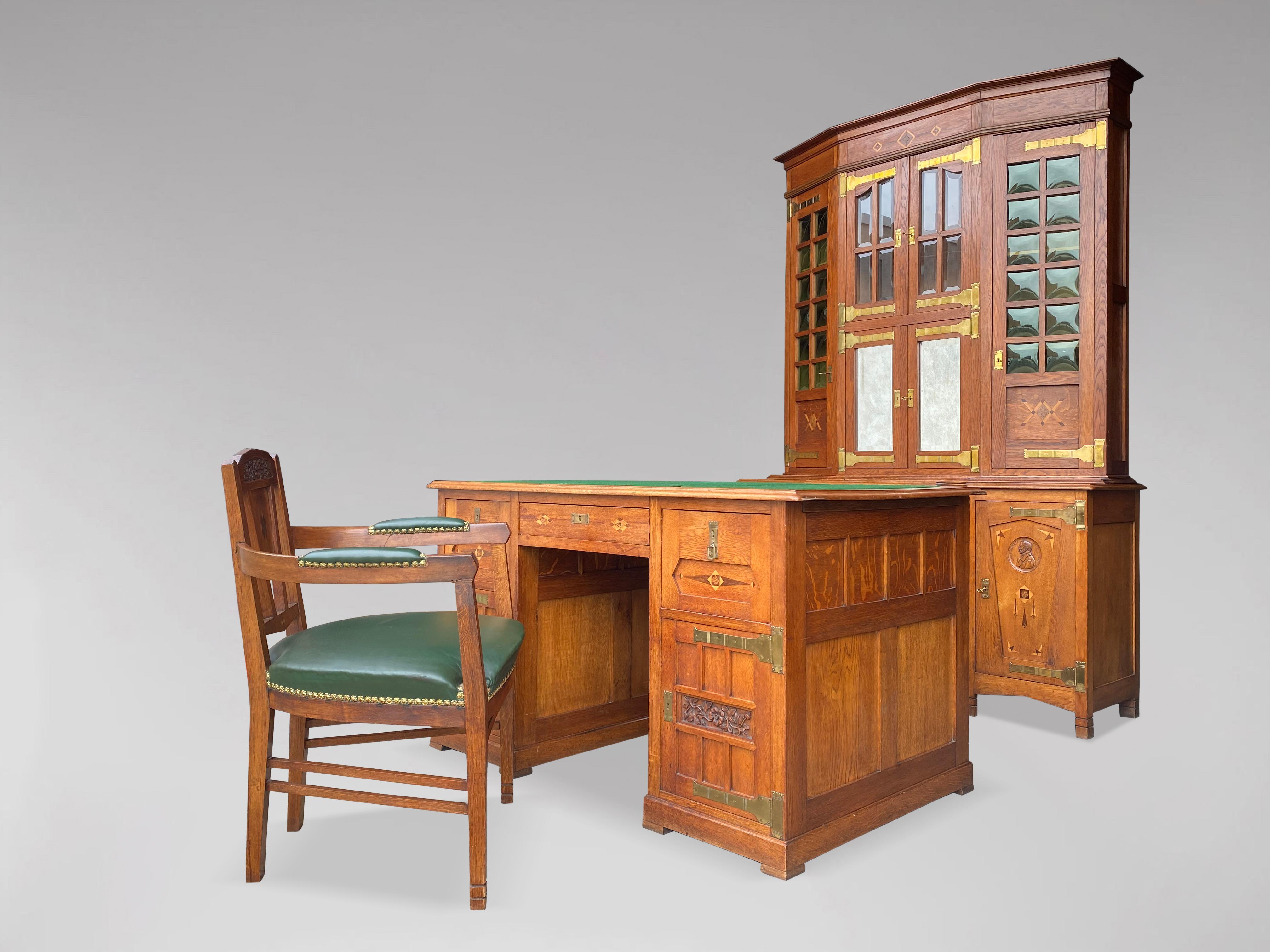 An oak Arts & Crafts, Art Nouveau set of 3 pieces, in the style of Gustave SERRURIER BOVY (1858-1910). A magnificent and rare set of three office and dining room furniture in oak, brass, rosewood and satinwood inlays comprising, an oak buffet or