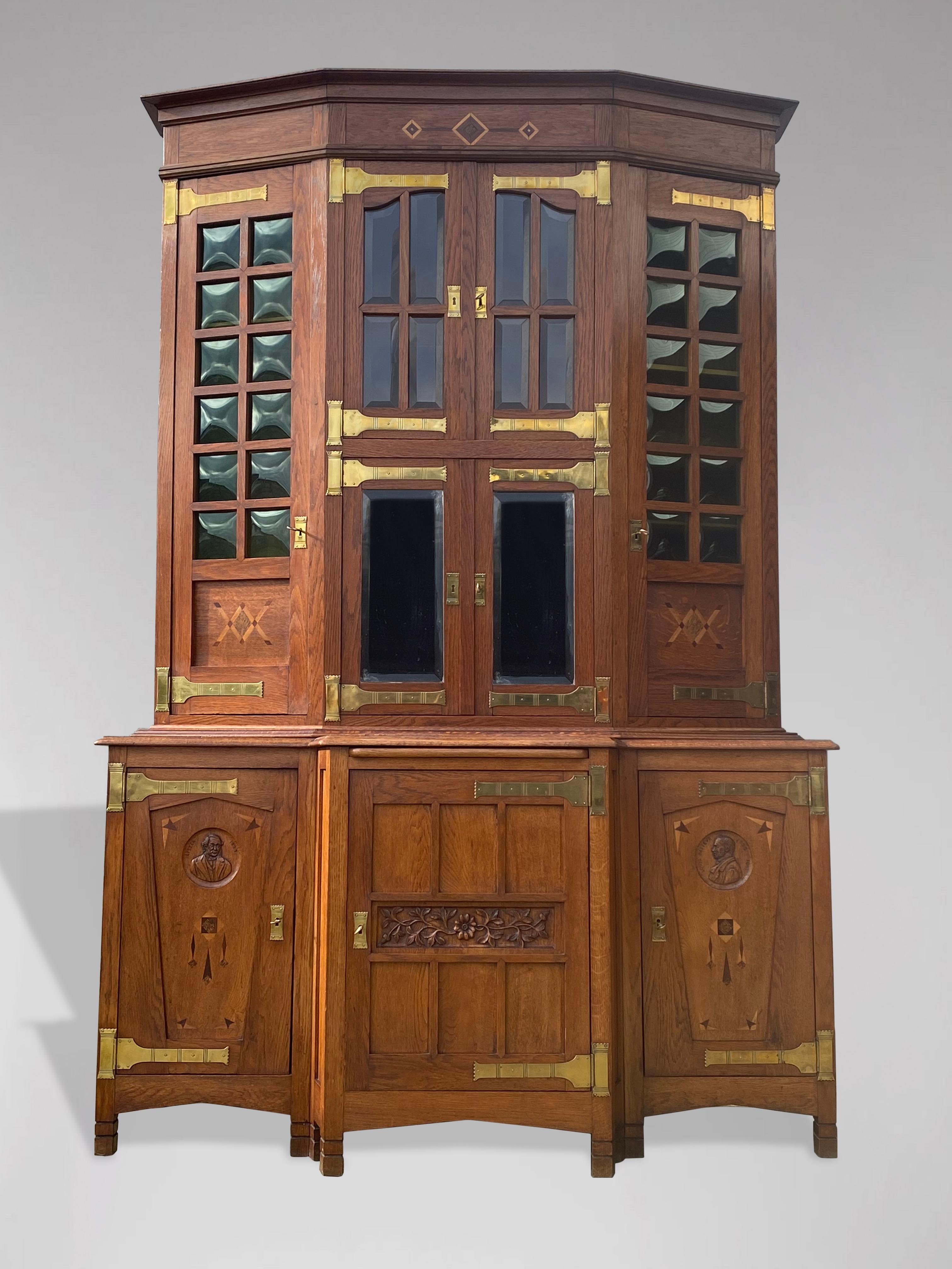 A magnificent and rare oak Arts & Crafts, Art Nouveau buffet or sideboard, in the style of Gustave SERRURIER BOVY (1858-1910). Solid oak, with original well shaped brass hinges, original bevelled green glass and bevelled mirrors, rosewood and