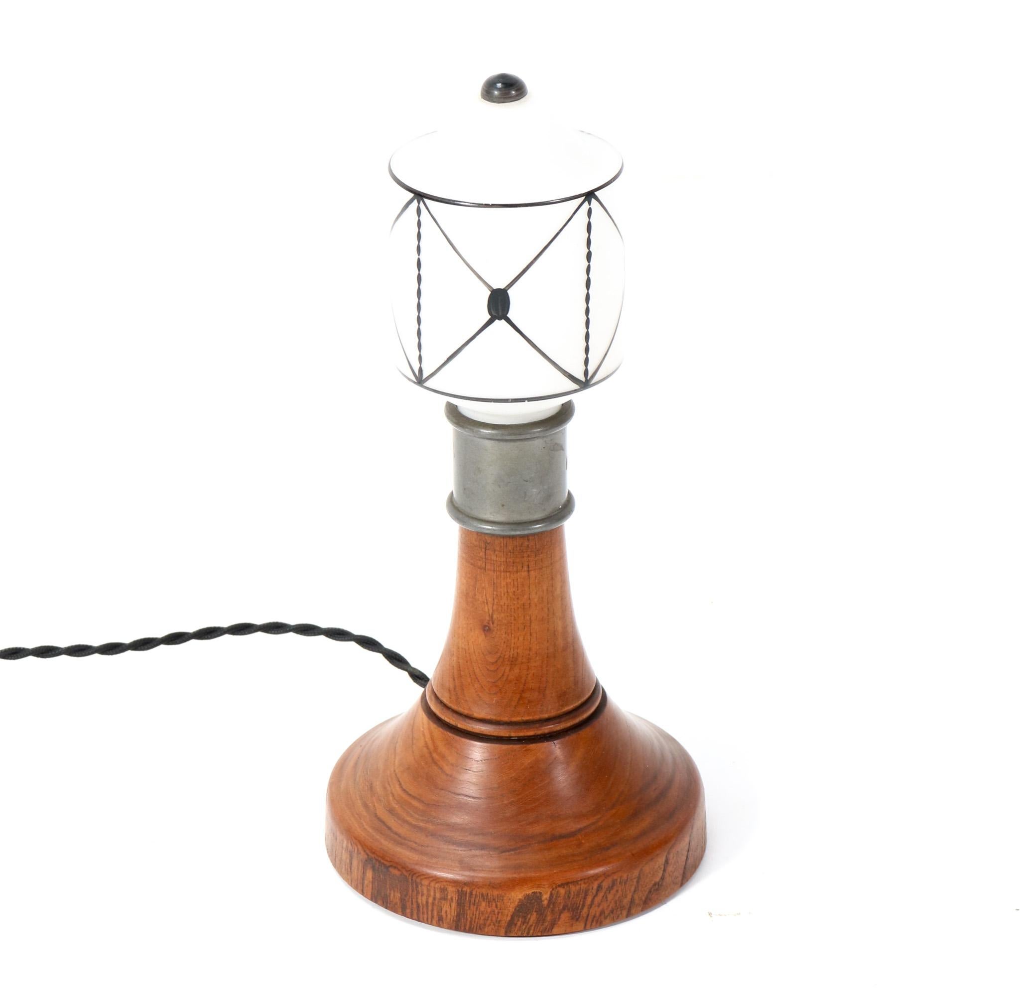 Wonderful and rare Arts & Crafts Art Nouveau table lamp.
Striking Dutch design from the 1900s.
Solid elm base with original milk glass shade.
Rewired with one socket for E-14 light bulb.
This wonderful Arts & Crafts Art Nouveau table lamp is in very