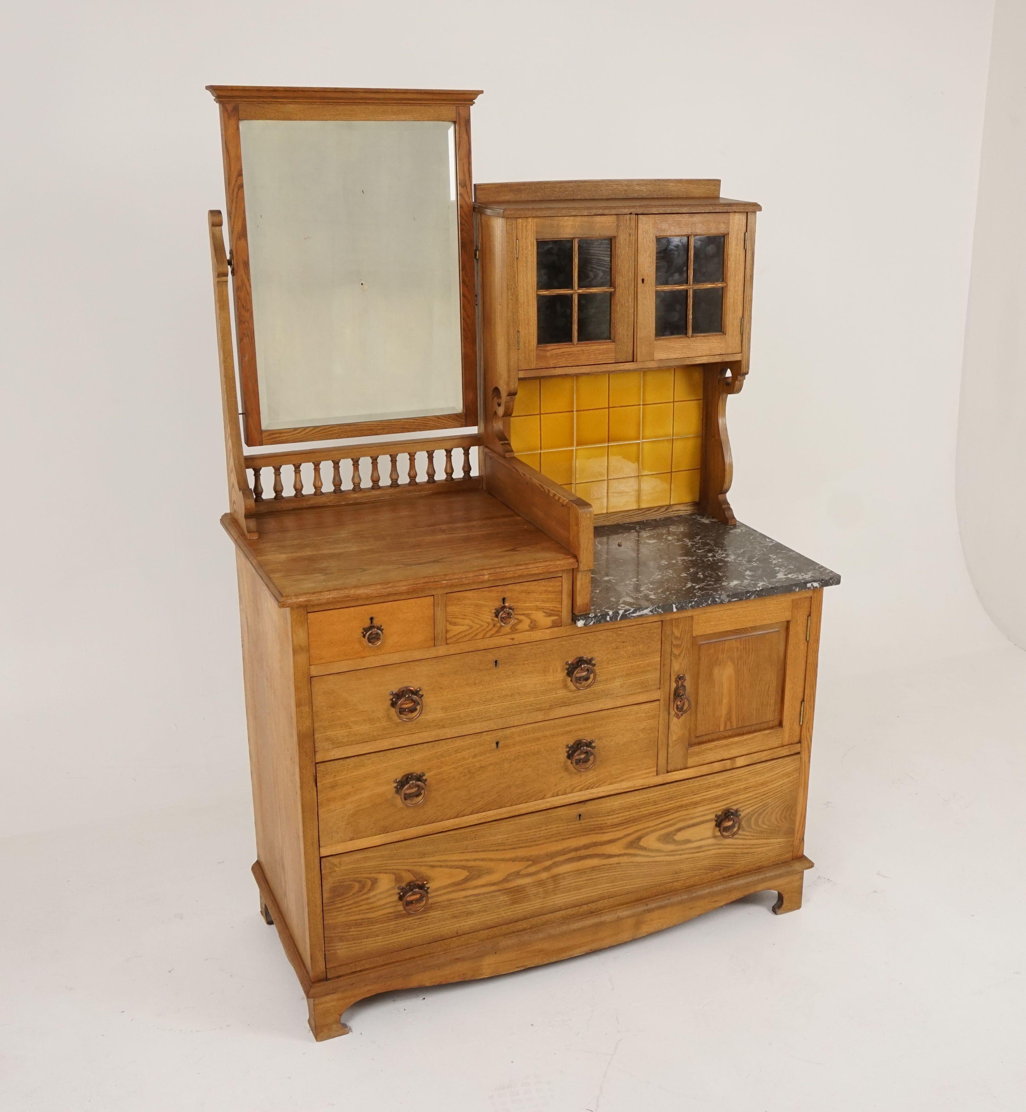 Arts & Crafts ash marble top vanity, dressing chest washstand, Scotland, 1900, B2164

Scotland, 1900
Solid ash
Original finish
Beveled mirror to left top
Pair of glass doors to the top right
Tiled back splash and grained marble top