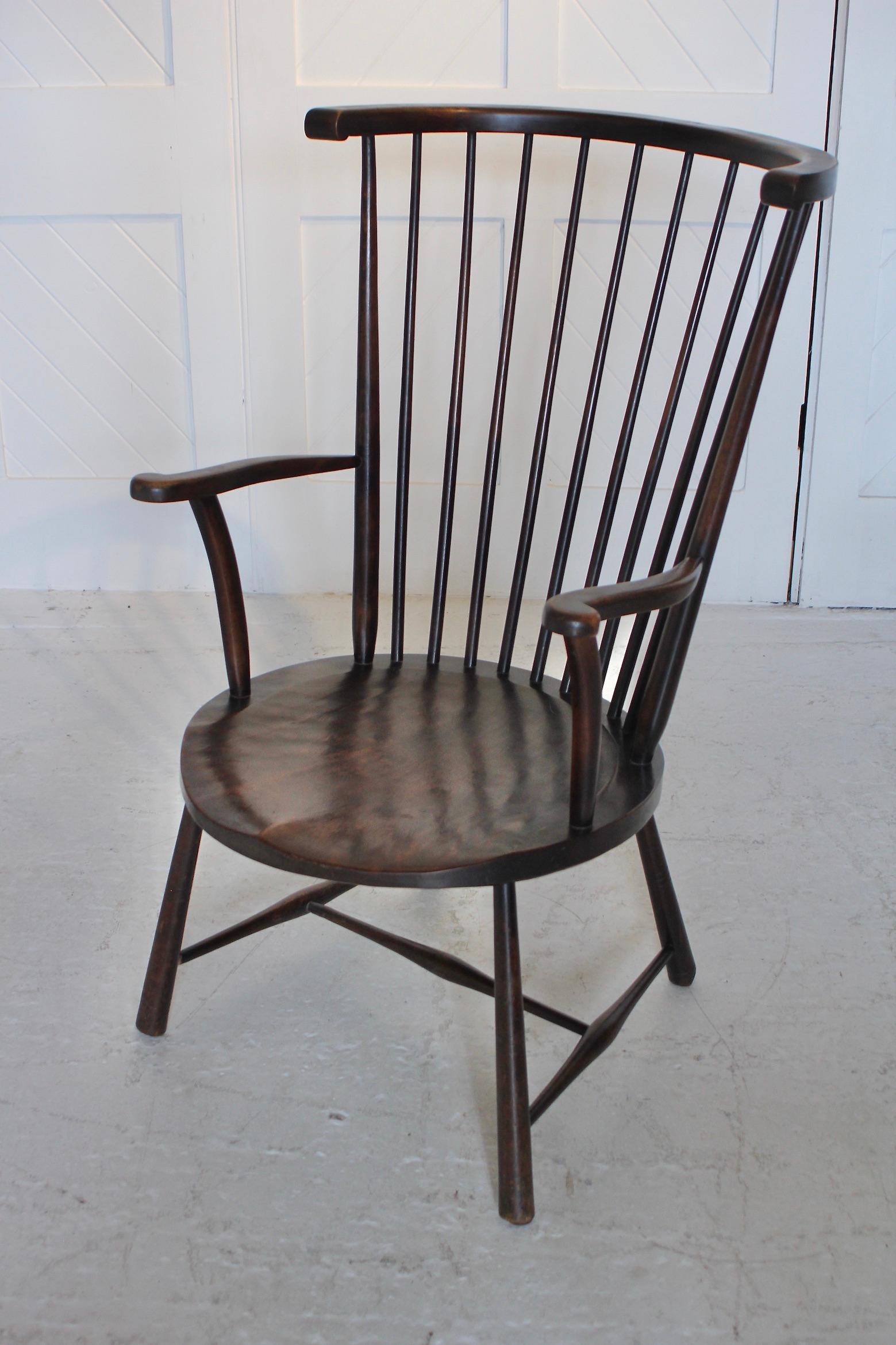 A fine example of a ‘Windsor’ style chair by Liberty & Co. 
Stylish tall stick-back design. 
This beech armchair dates from around 1875.