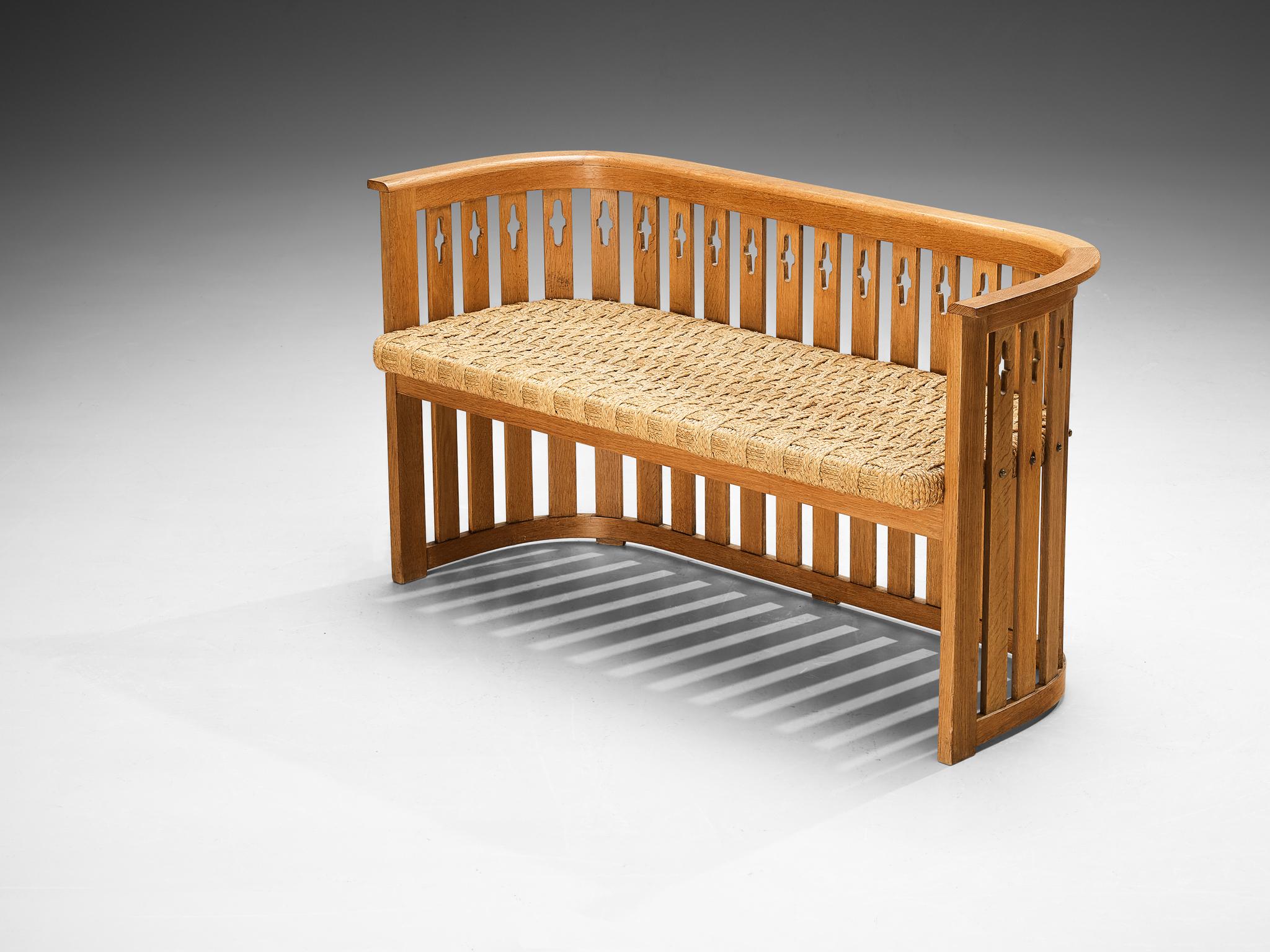 Bench, oak, braided straw, Europe, 1920s

This bench is designed during the Arts & Crafts period in Europe approximately around the twenties and designed by an experienced craftsman whose identity is unfortunately not yet known. The design resonates