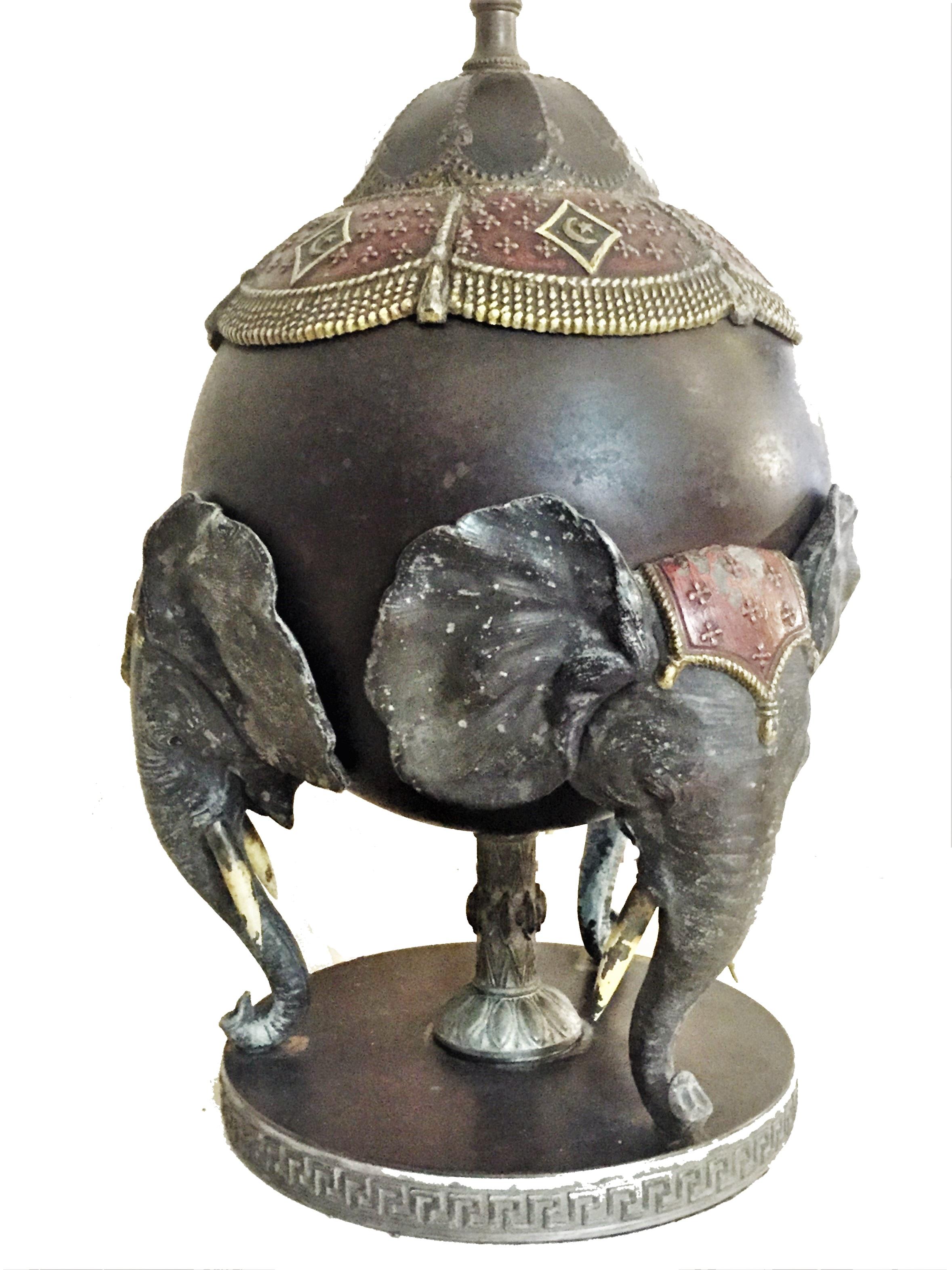 Attributed to Bradley & Hubbard. This rare “elephant Lamp” features a classic Bradley & Hubbard design of three elephants, holding a sphere. 

Beautiful patina to original finish with bronze appearance. Will work surprisingly in harmony with a