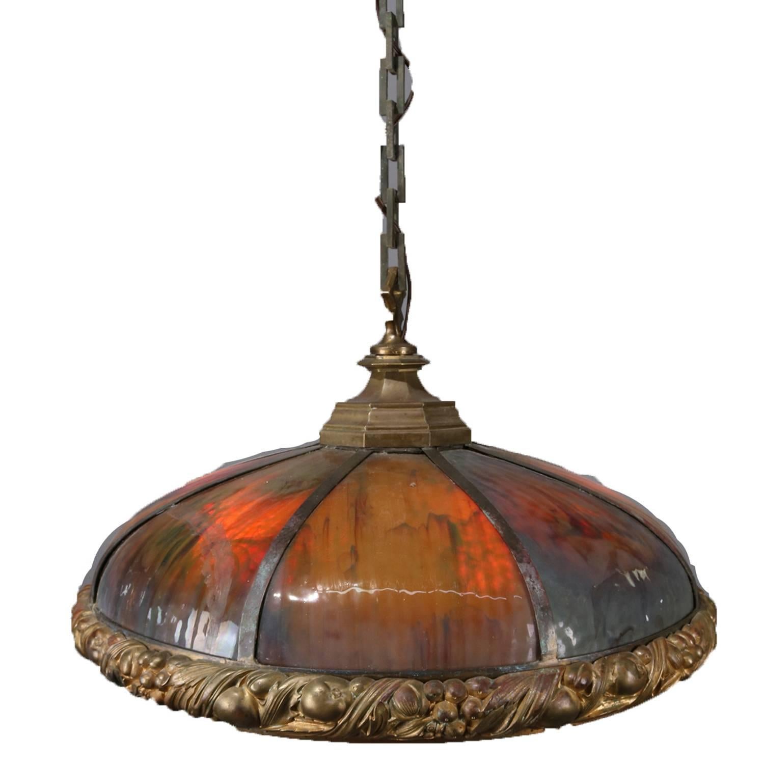 Arts & Crafts Bradley & Hubbard School six-light pendant dome chandelier features six bent slag panels seated in cast fruit and nut form gilt frame, newly re-wired, circa 1910.

Measures: 18