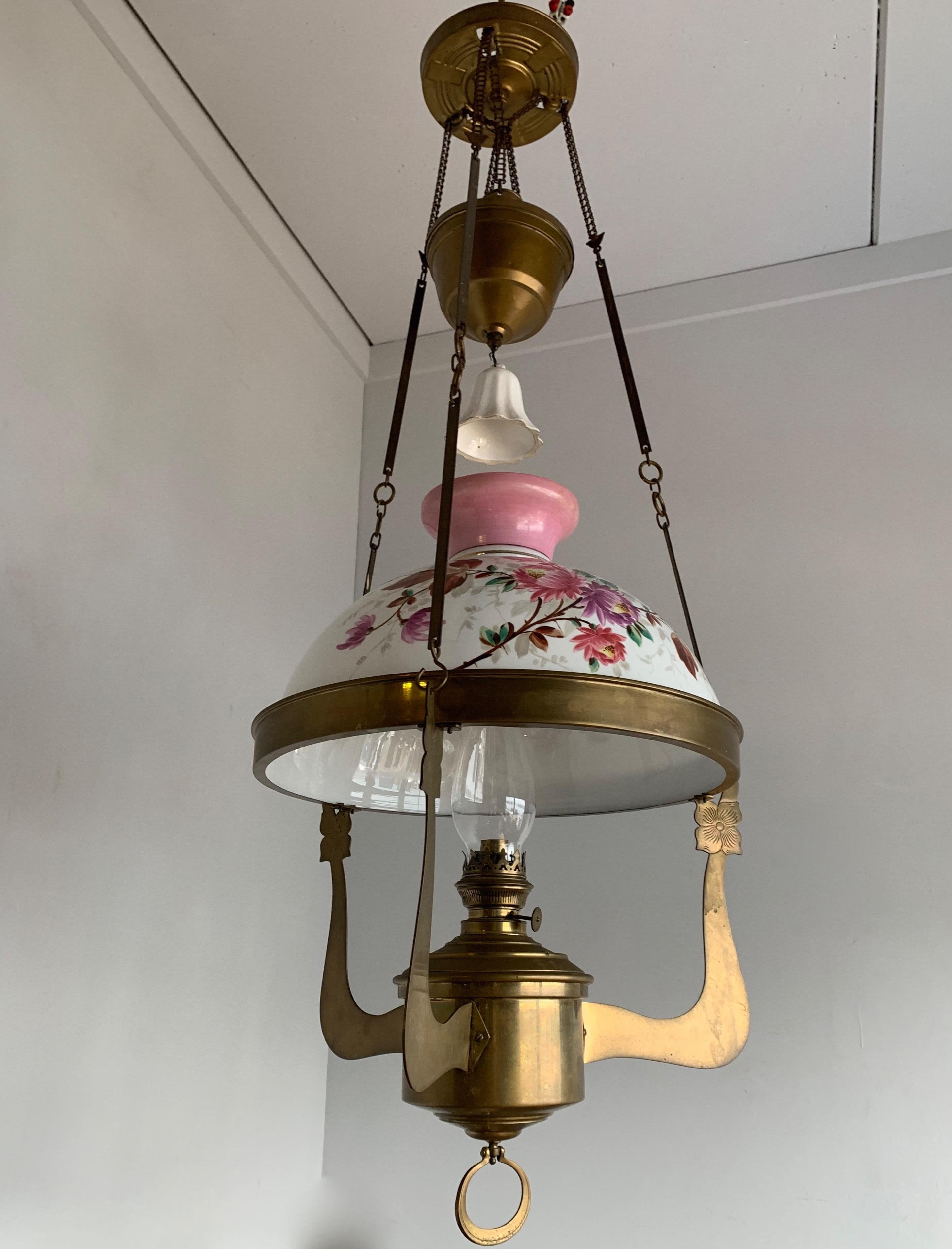 Antique, stunning and rare, hand painted oil lamp.

This large and impressive oil lamp dates from the early 1900s and the Arts & Crafts design is exceptional. It is made of top quality materials and with expensive techniques and that is one of the