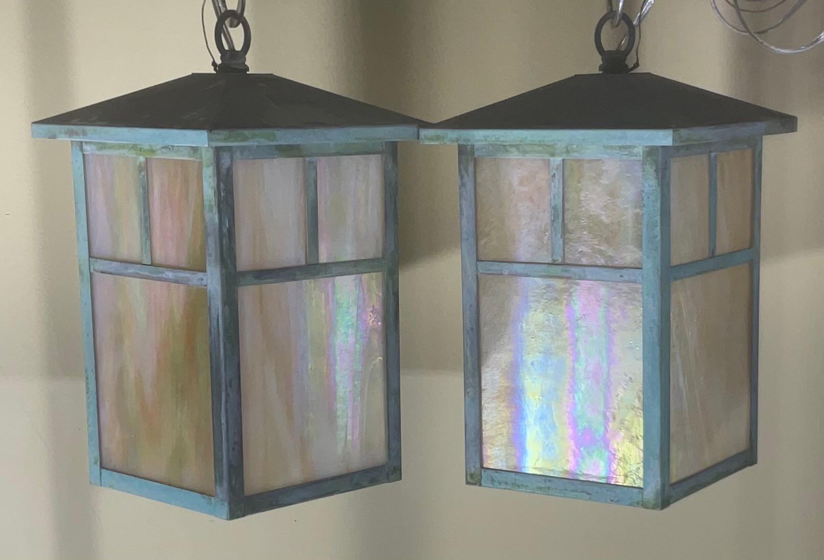  20th century Arts & Crafts pendant light in a lantern design. Features  textured beautiful art glass shades , one 60/watt light. Original nice patina.
Canopy is not included.
Will sale single light upon request.