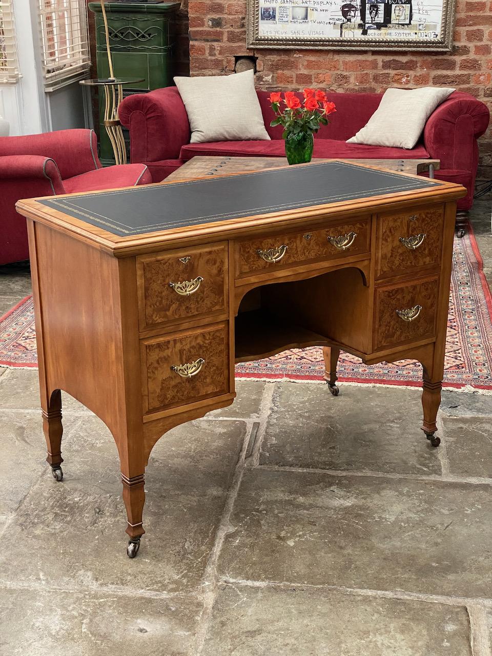 Magnificent late 19th century Arts & Crafts burr walnut kneehole desk by Shapland & Petter of Barnstaple circa 1890, the rectangular burr walnut top with inset black and gilt tooled skived leather writing surface, above a central frieze drawer over