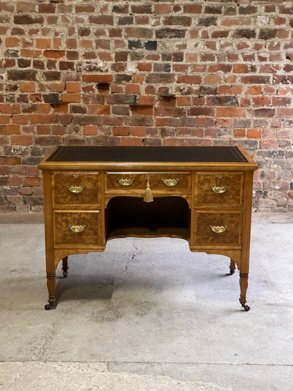Magnificent late 19th century Arts & Crafts burr walnut kneehole desk by Shapland & Petter of Barnstaple circa 1890, the rectangular burr walnut top with inset black and gilt tooled skived leather writing surface, above a central frieze drawer over