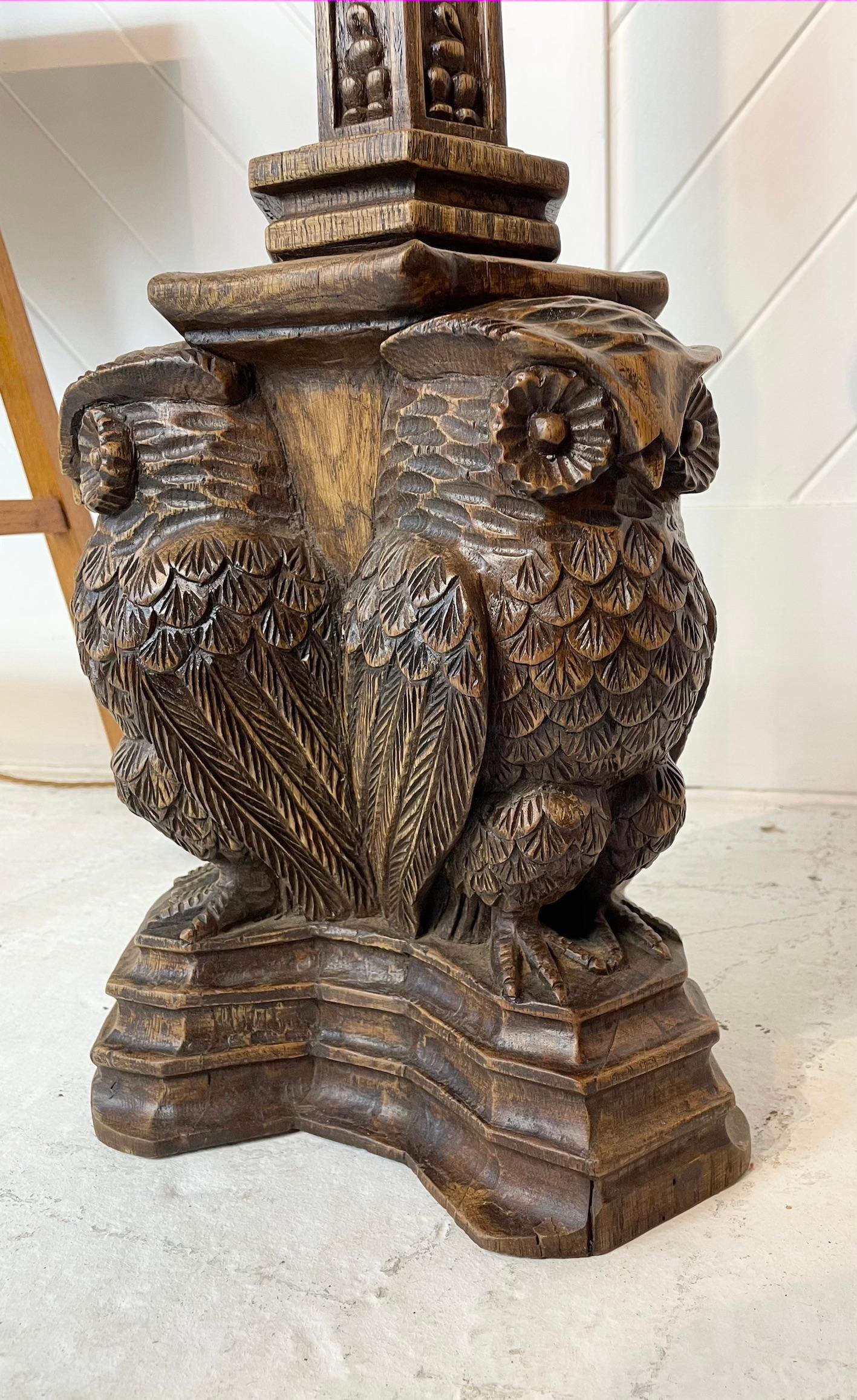 Magnificent carved oak standard lamp
The carving depicts stylised leaf design to the top and is further replicated on the stand
The column has carved insects around it
The base depicts 3 carved large owls standing on a plinth
It is in the manner of